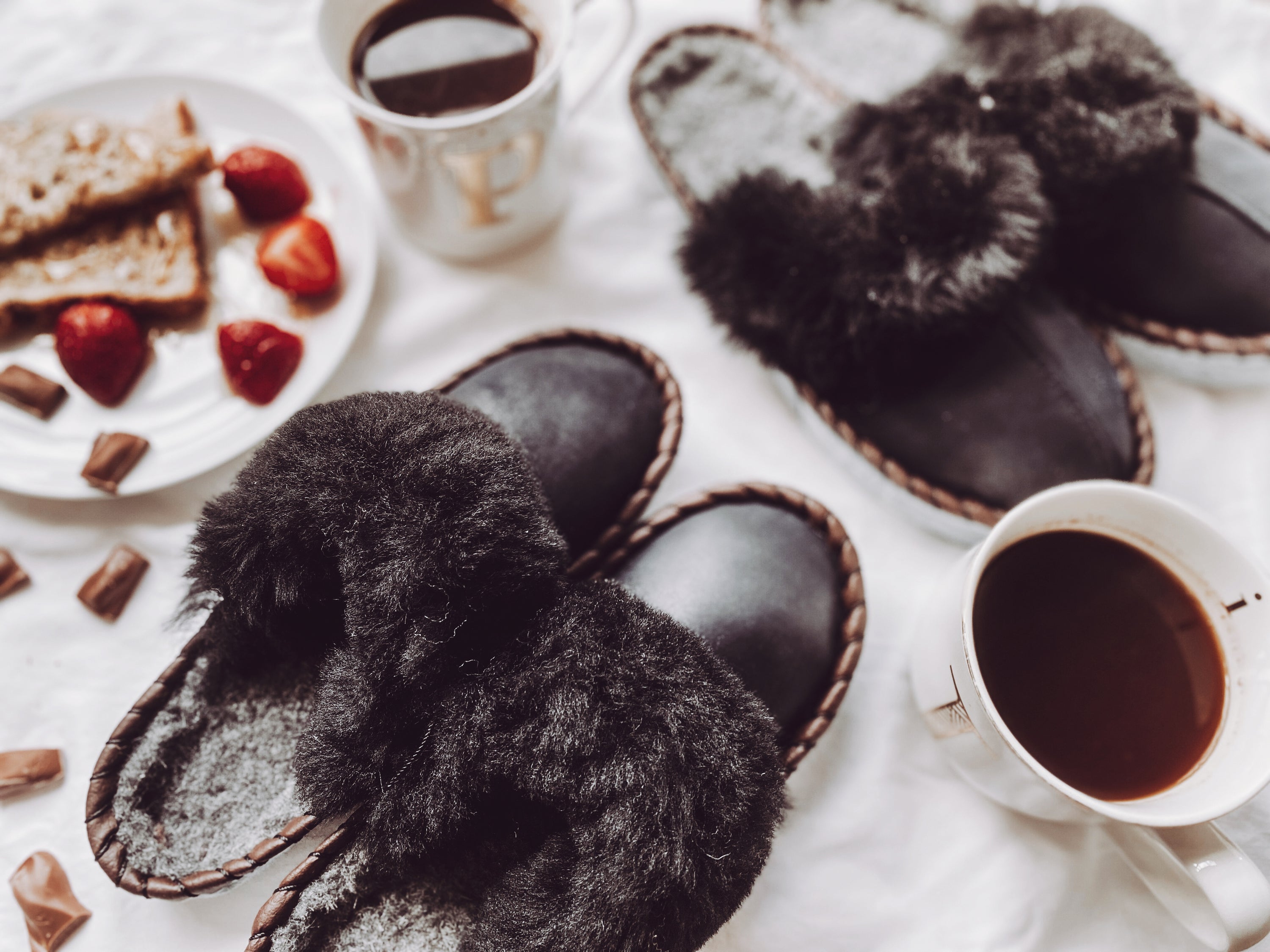 Mens Onyx Black Slip Ons featuring black leather and fur cuff, showcasing a stylish and comfortable design.