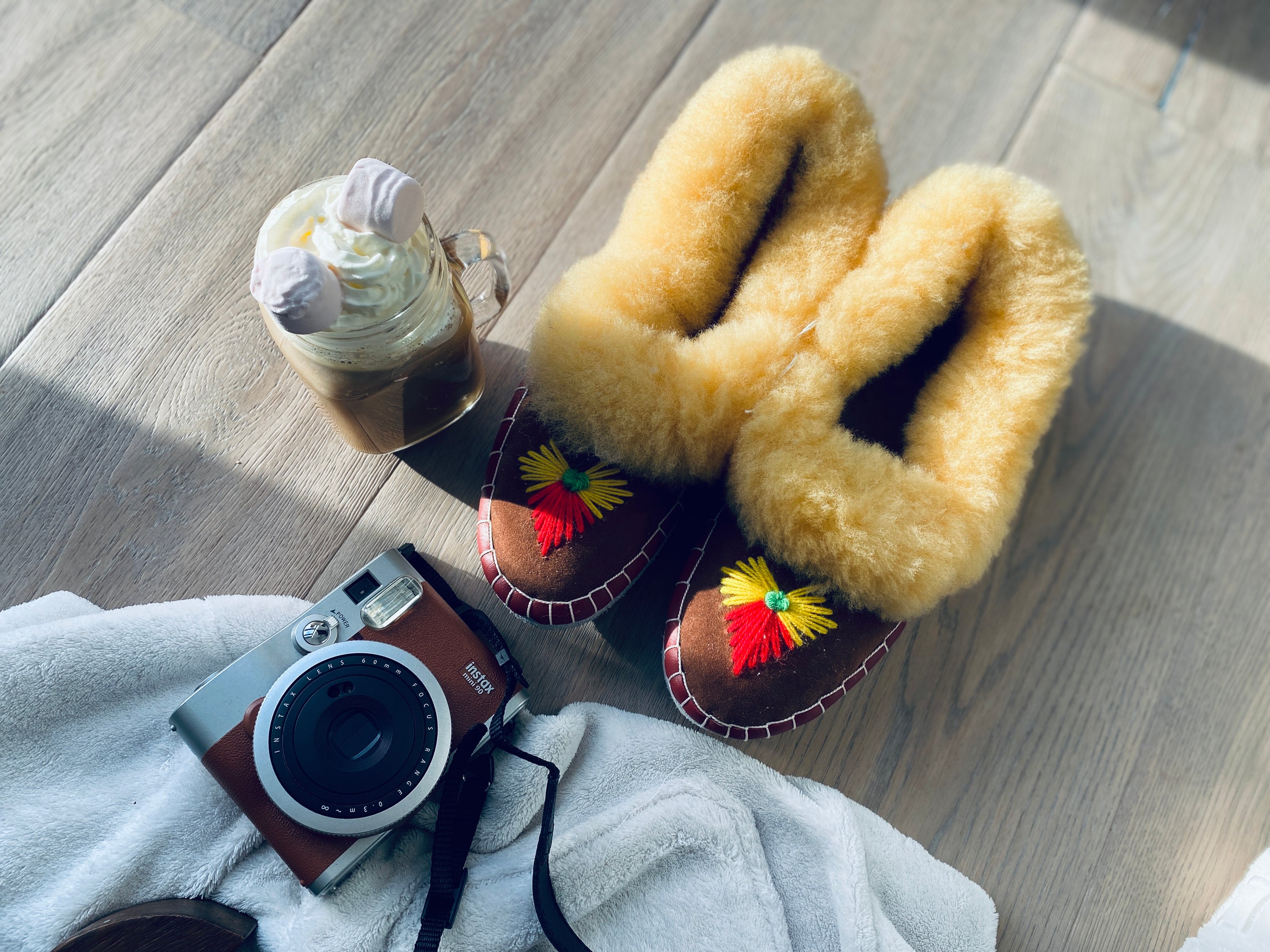 Natural Fur Embroidered Moccasin Slippers showcasing vibrant colors and a fluffy fur cuff, perfect for indoor comfort.