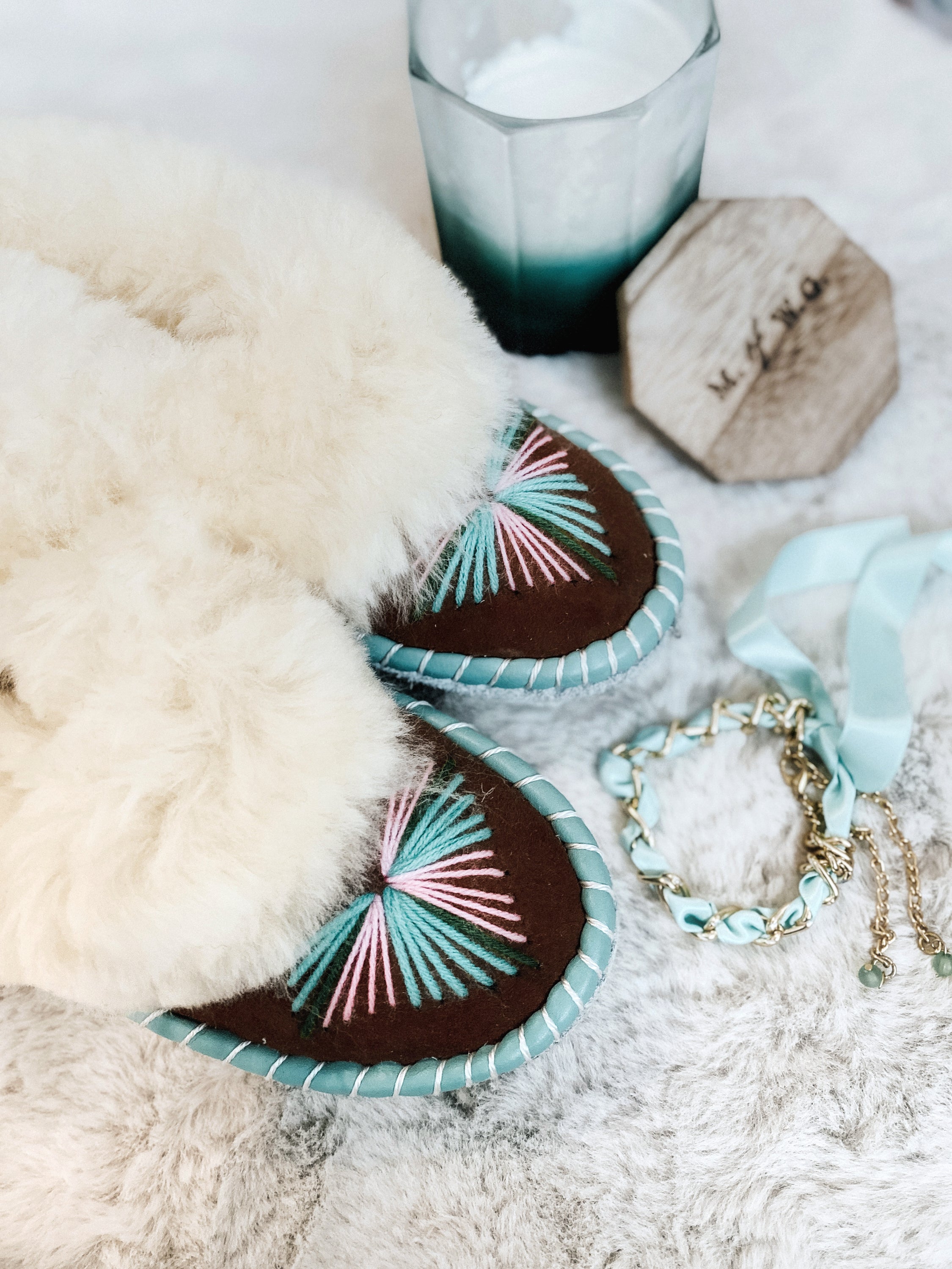 Natural Fur Embroidered Moccasin Slippers showcasing vibrant colors and a fluffy fur cuff, perfect for indoor comfort.