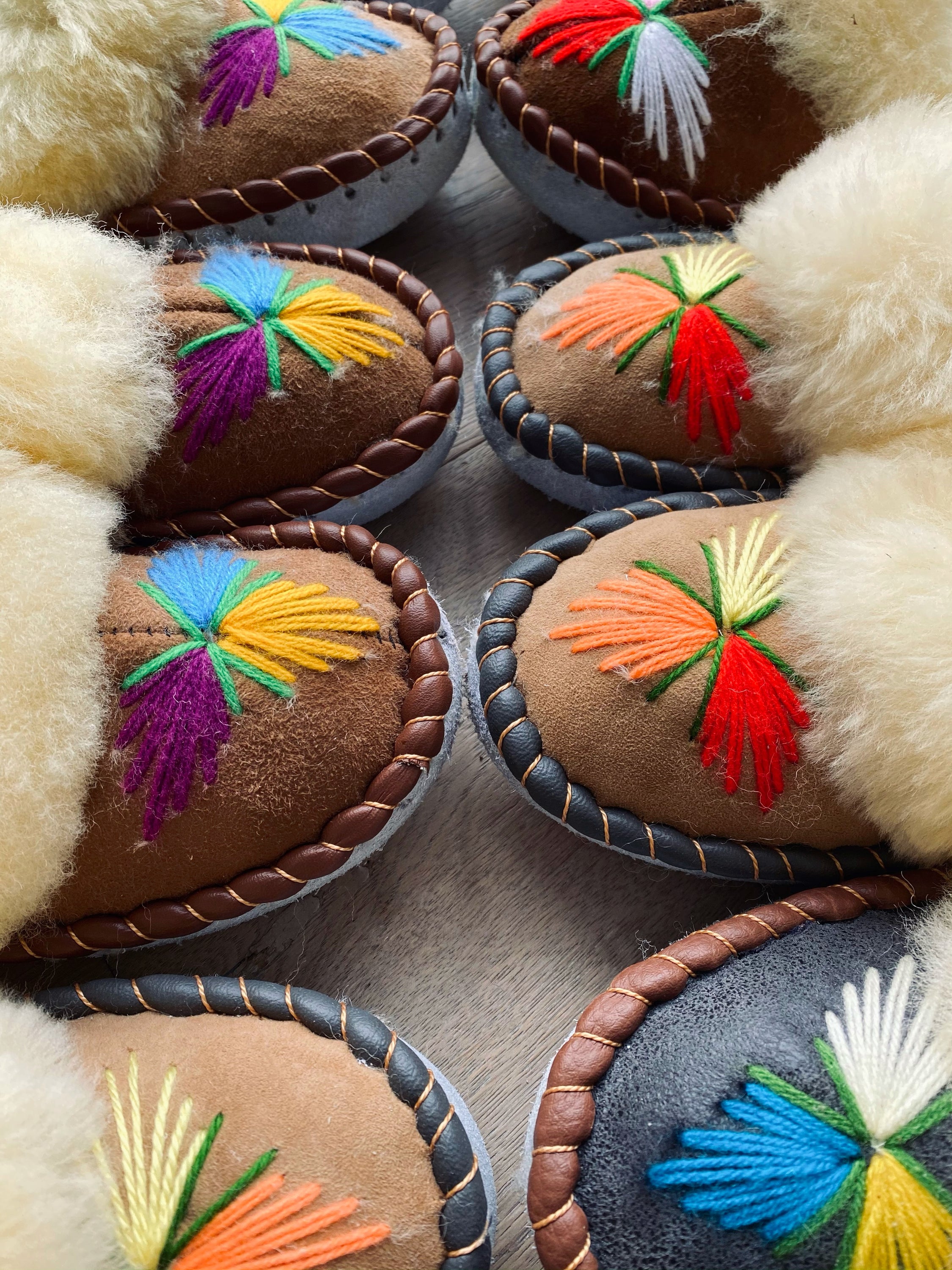 Natural Fur Embroidered Moccasin Slippers showcasing vibrant colors and a fluffy fur cuff, perfect for indoor comfort.