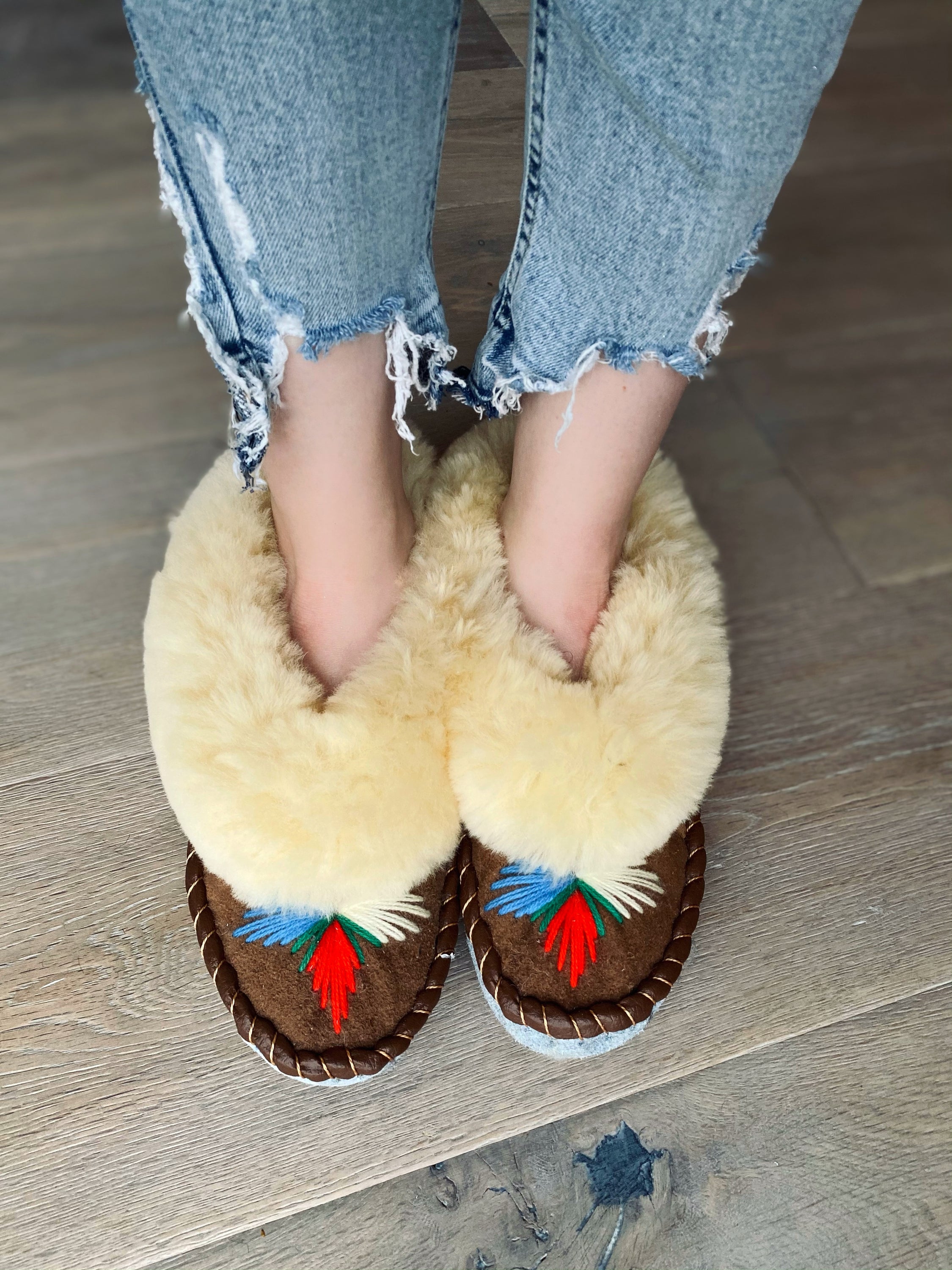 Natural Fur Embroidered Moccasin Slippers showcasing vibrant colors and a fluffy fur cuff, perfect for indoor comfort.