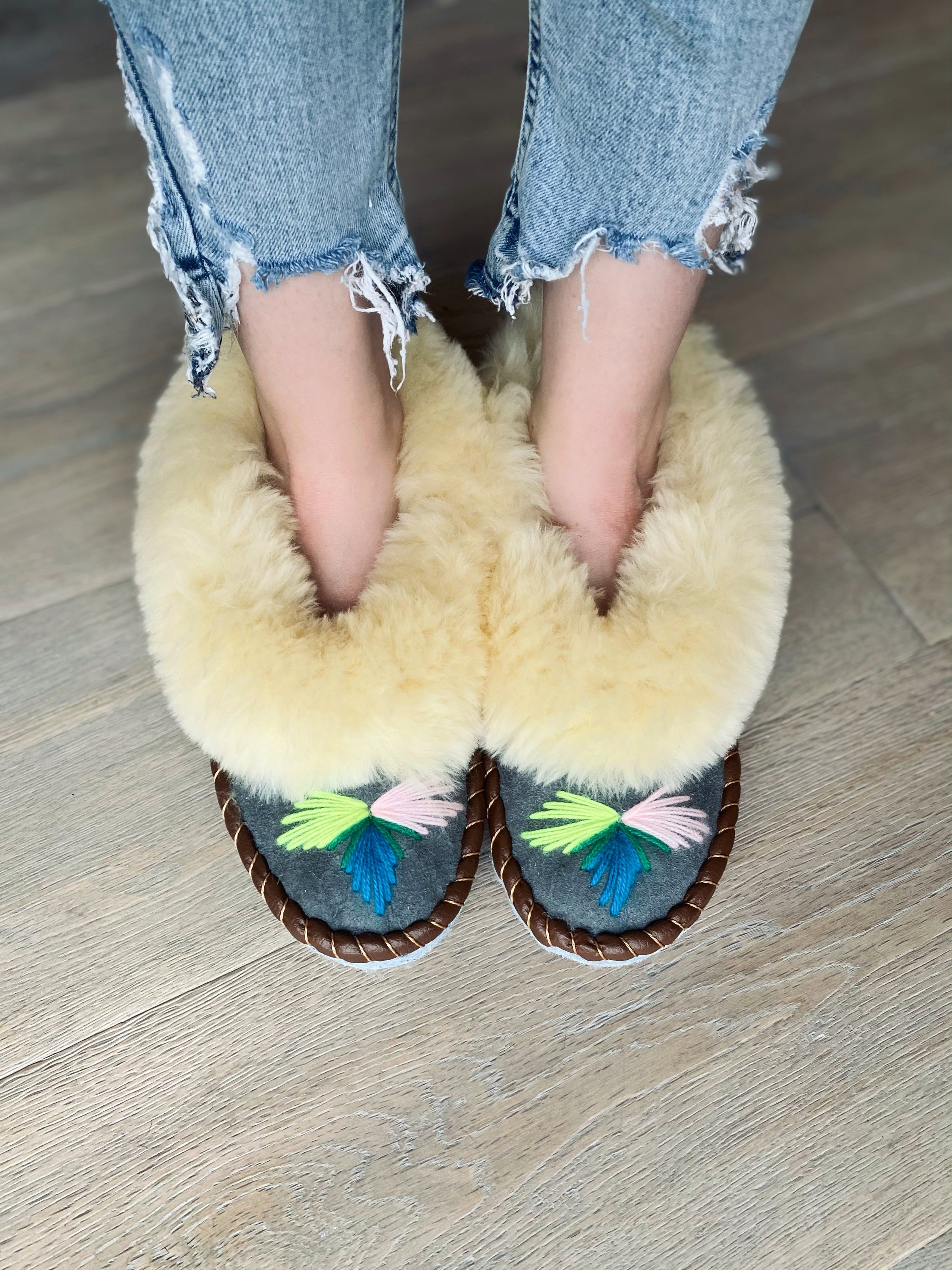 Natural Fur Embroidered Moccasin Slippers showcasing vibrant colors and a fluffy fur cuff, perfect for indoor comfort.