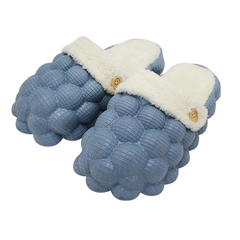 A pair of Non-slip Warm Cotton Bubble Slides in a cozy indoor setting, showcasing their soft cotton material and non-slip sole.