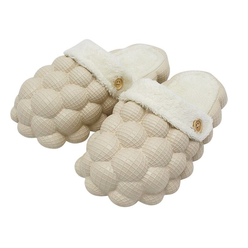 A pair of Non-slip Warm Cotton Bubble Slides in a cozy indoor setting, showcasing their soft cotton material and non-slip sole.