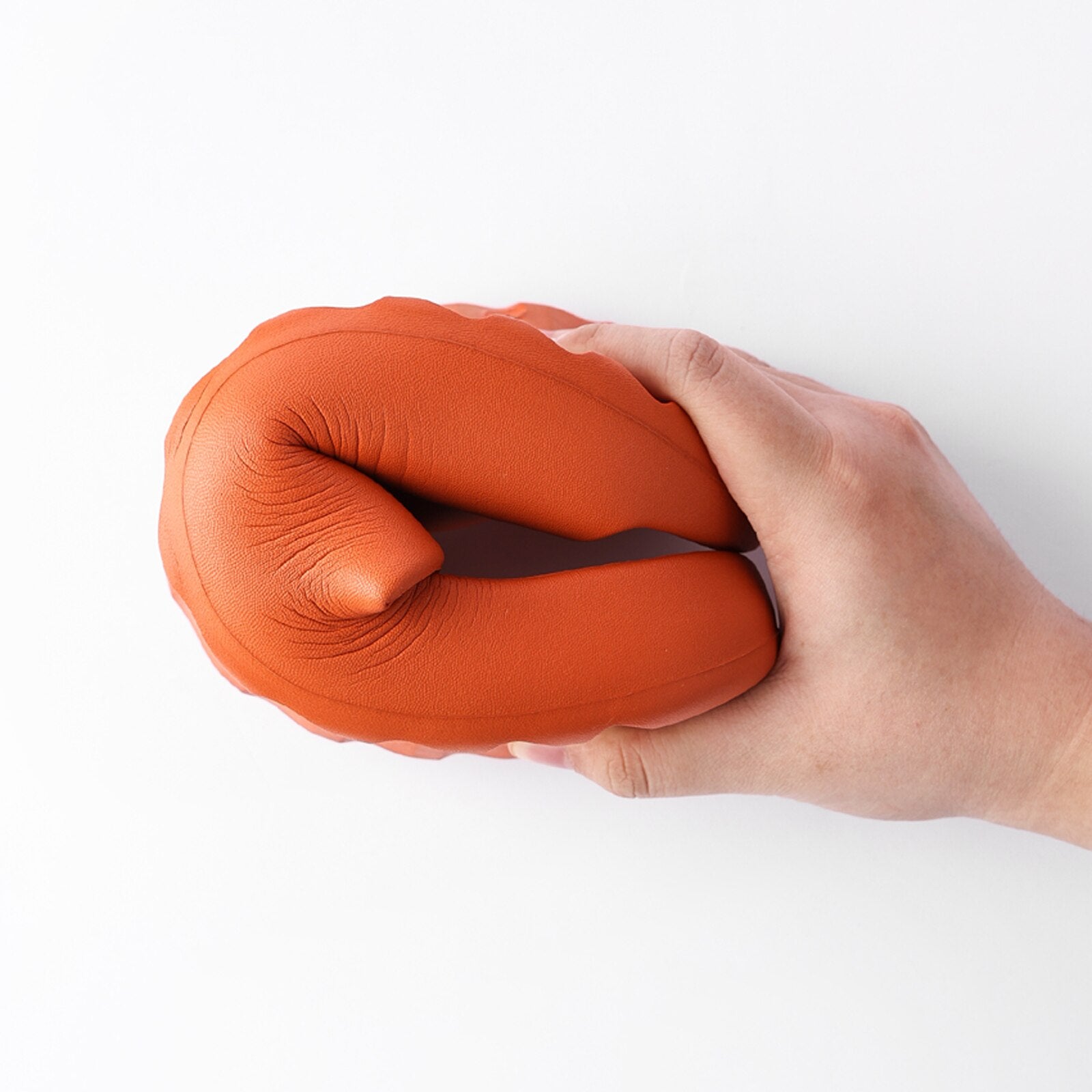 A pair of orange chunky platform pillow slides for women, featuring an open toe design and a cushioned insole, perfect for casual wear and shower use.