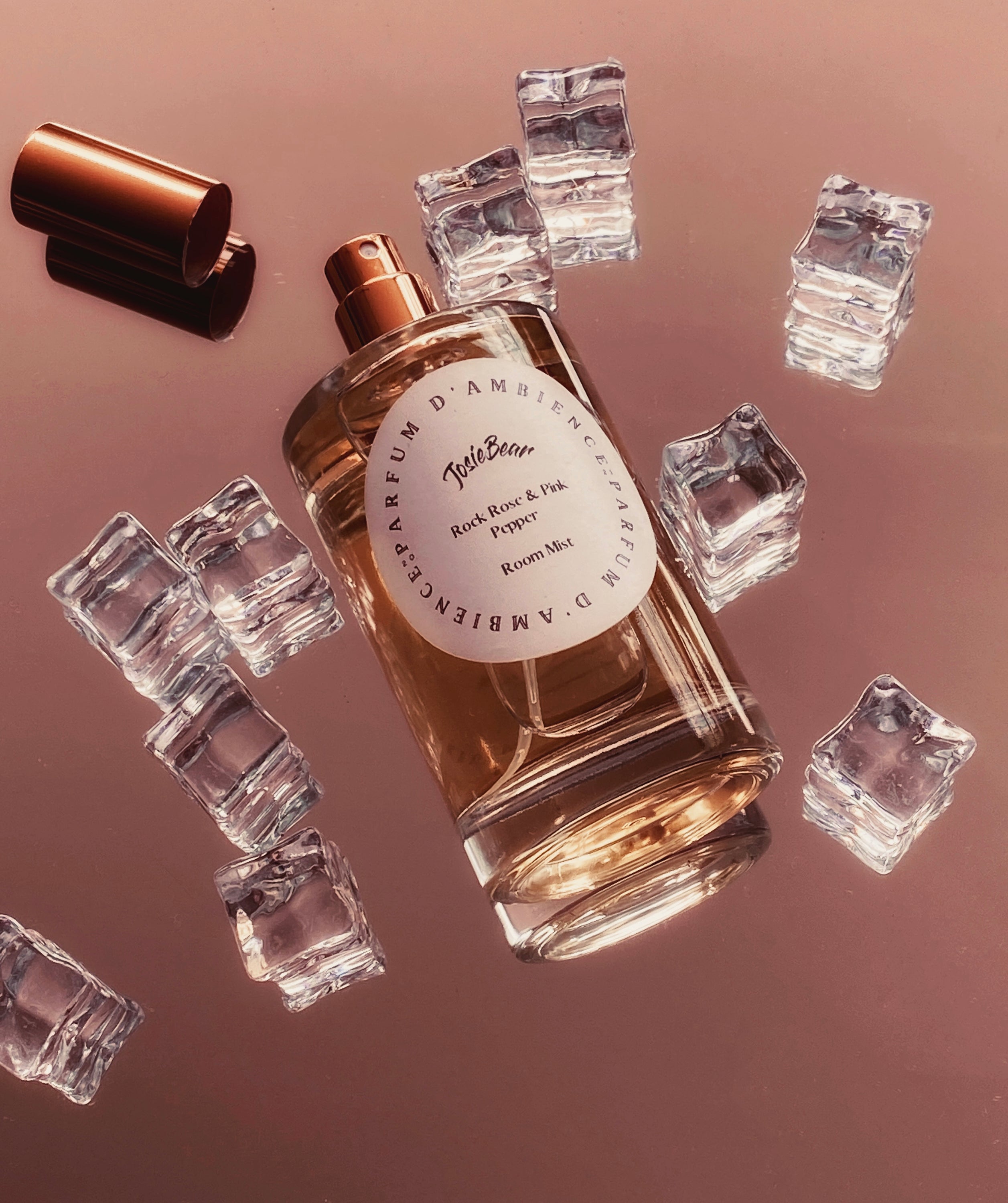 Rock Rose & Pink Pepper Room Mist in an elegant eco-friendly glass bottle, showcasing its floral and spicy fragrance.