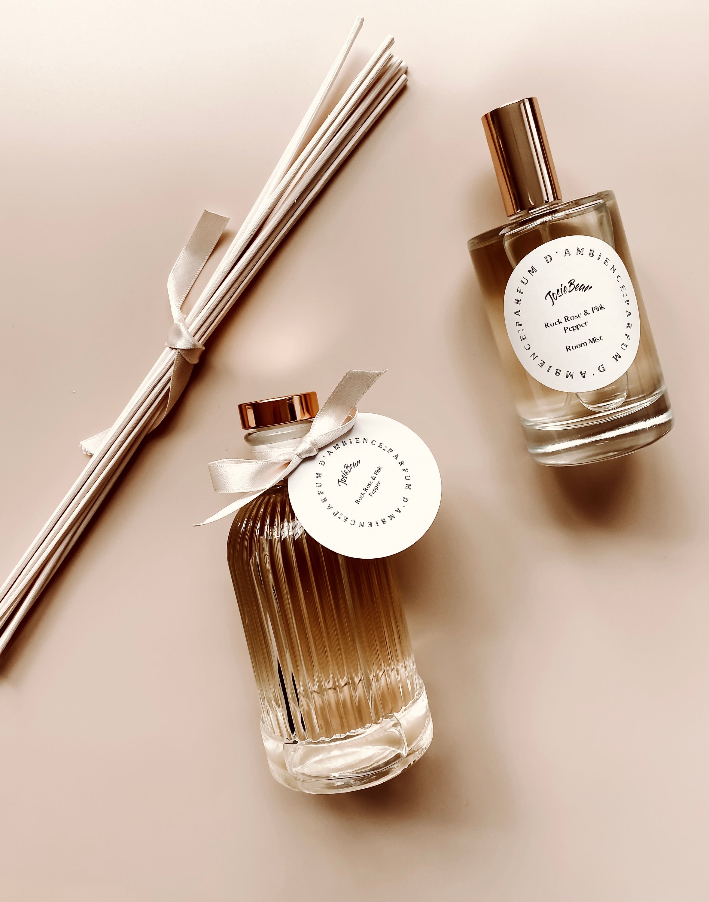 Rock Rose & Pink Pepper Room Mist in an elegant eco-friendly glass bottle, showcasing its floral and spicy fragrance.