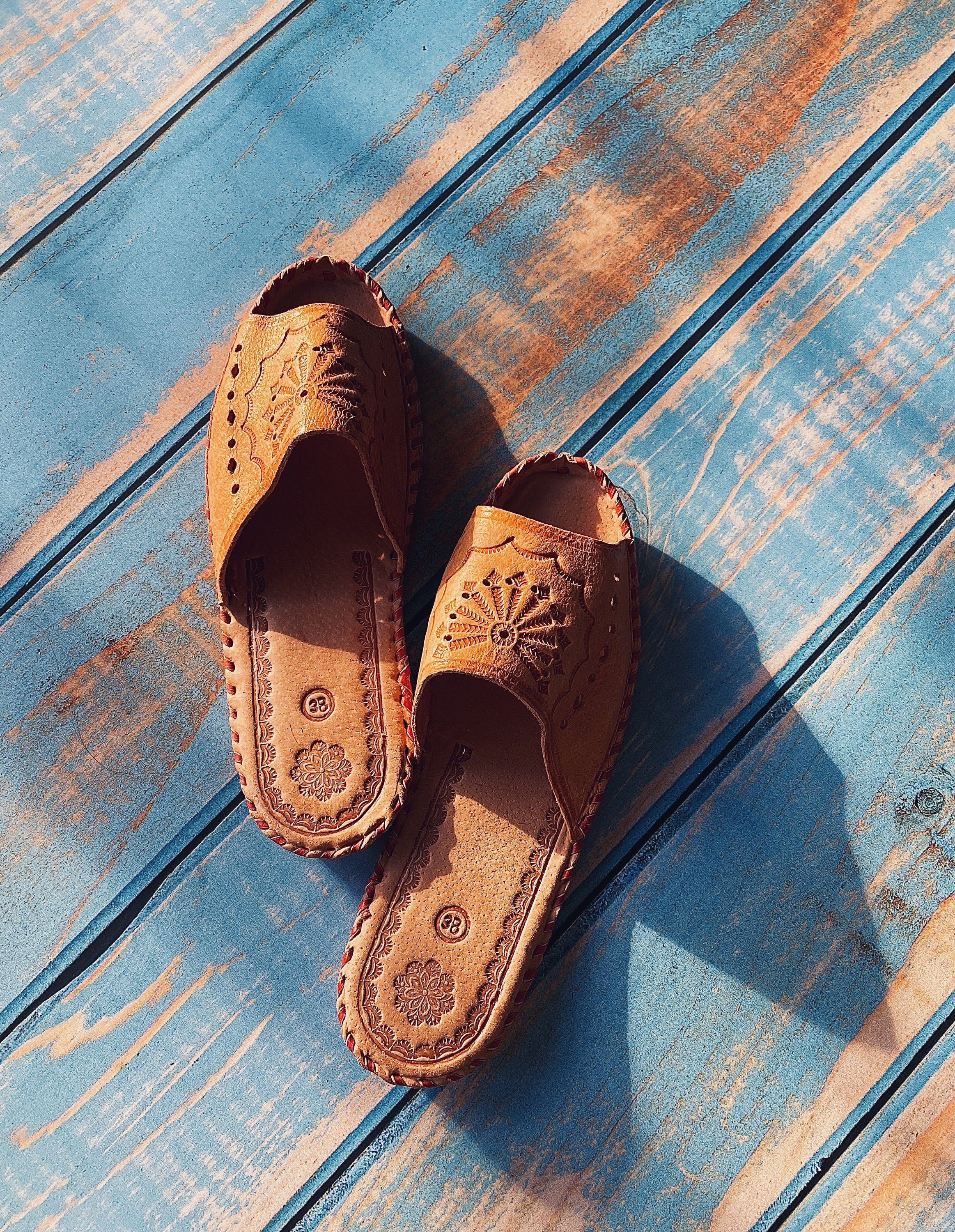 Wanderlust Open Toe Slippers featuring handmade leather with boho embroidery, perfect for warm weather wear.