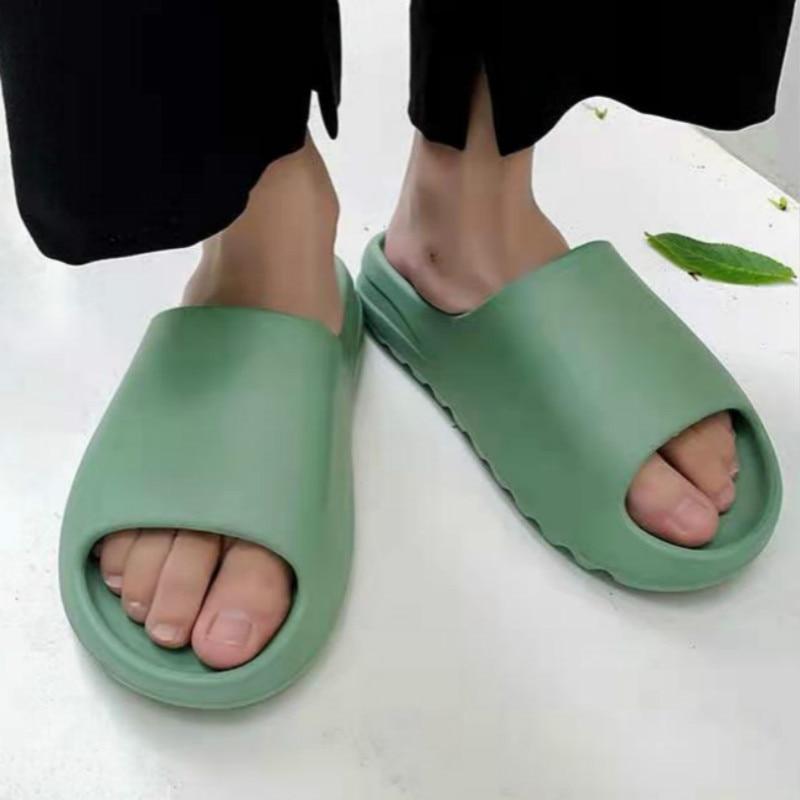 Yeezy Inspired Slides in vibrant green color, showcasing a stylish and comfortable design perfect for casual wear.