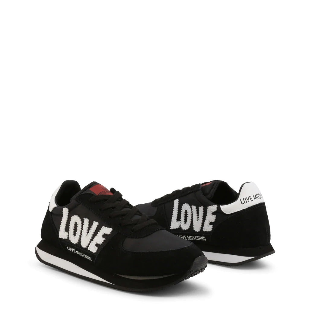 A pair of stylish black suede sneakers with a 3cm platform heel and embroidered 'Love' logo, showcasing their elegant design.