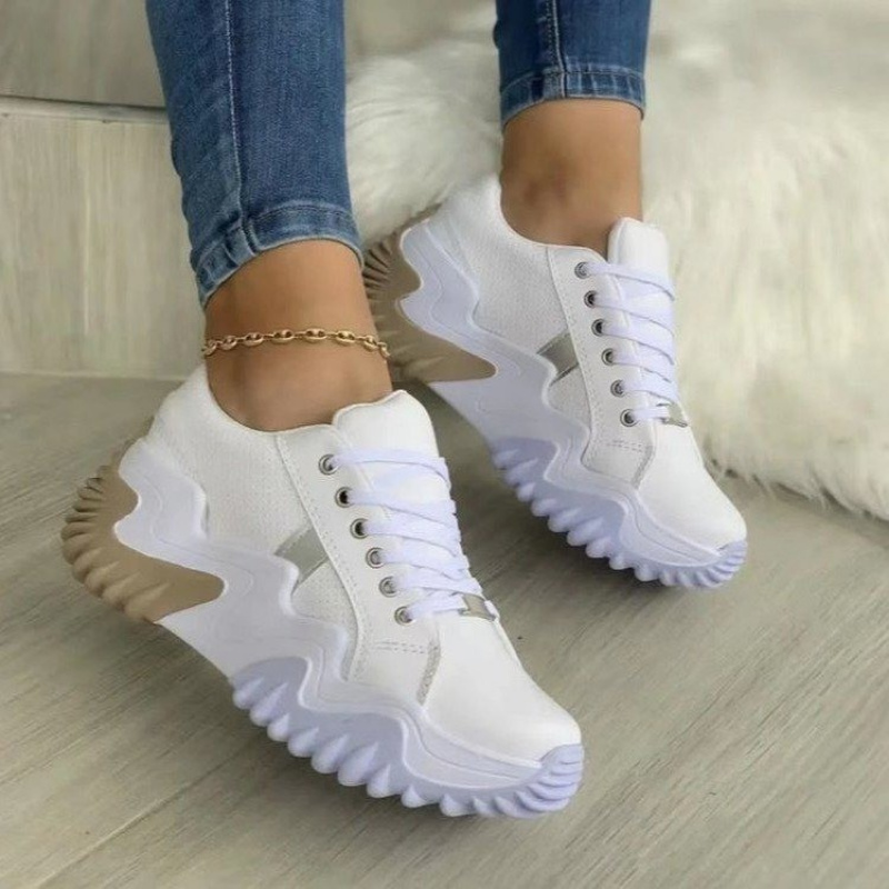 A pair of stylish breathable vulcanized women shoes in a casual platform sneaker design, showcasing their sleek look and comfortable fit.