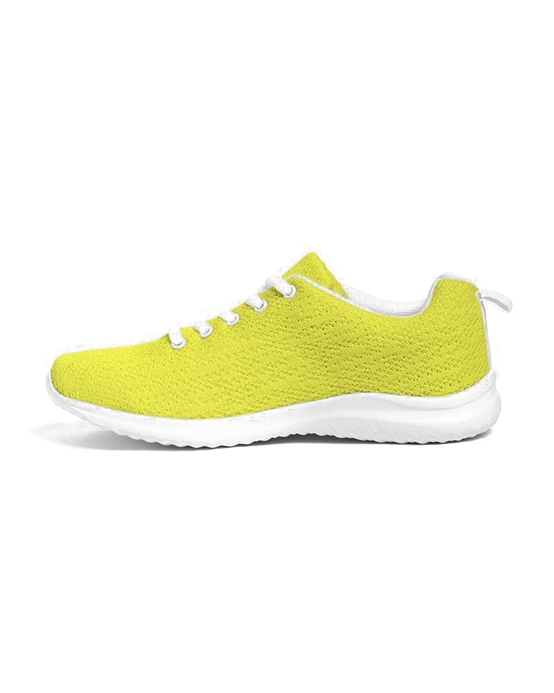 Men's yellow low top canvas running sports shoes with lace-up front, breathable lining, and padded collar, perfect for athletic activities.