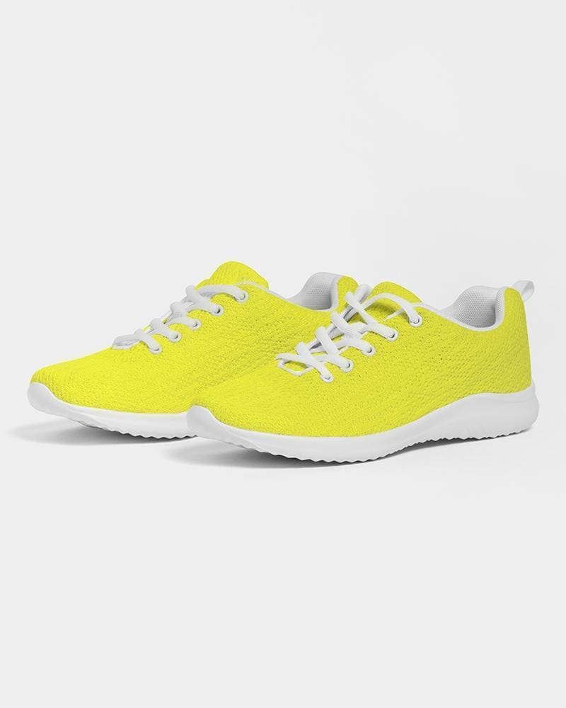 Men's yellow low top canvas running sports shoes with lace-up front, breathable lining, and padded collar, perfect for athletic activities.