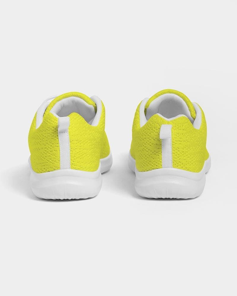 Men's yellow low top canvas running sports shoes with lace-up front, breathable lining, and padded collar, perfect for athletic activities.