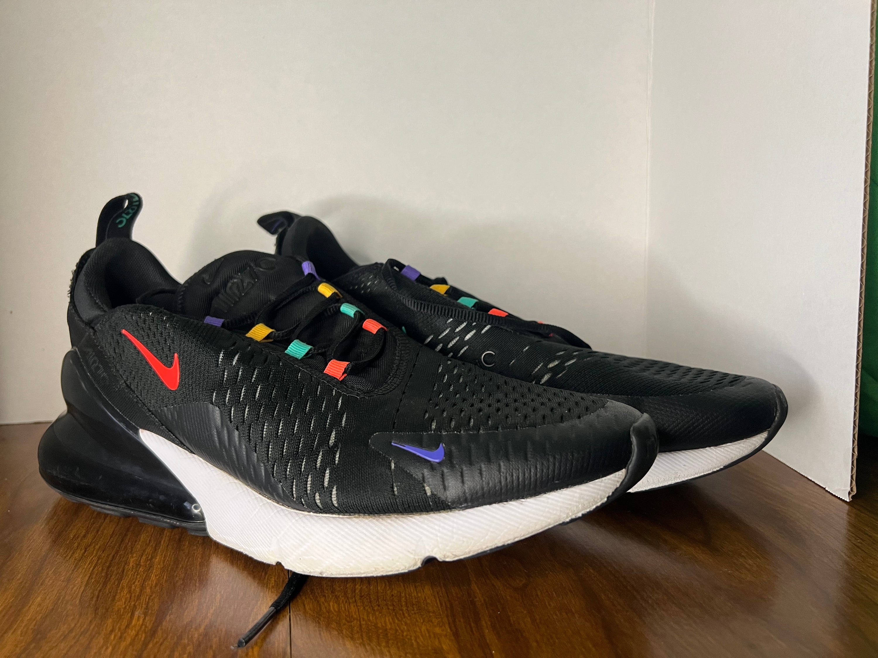 Nike Air Max 270 sneakers in black and multicolor design, size 11.5 for men, showcasing stylish and comfortable athletic footwear.