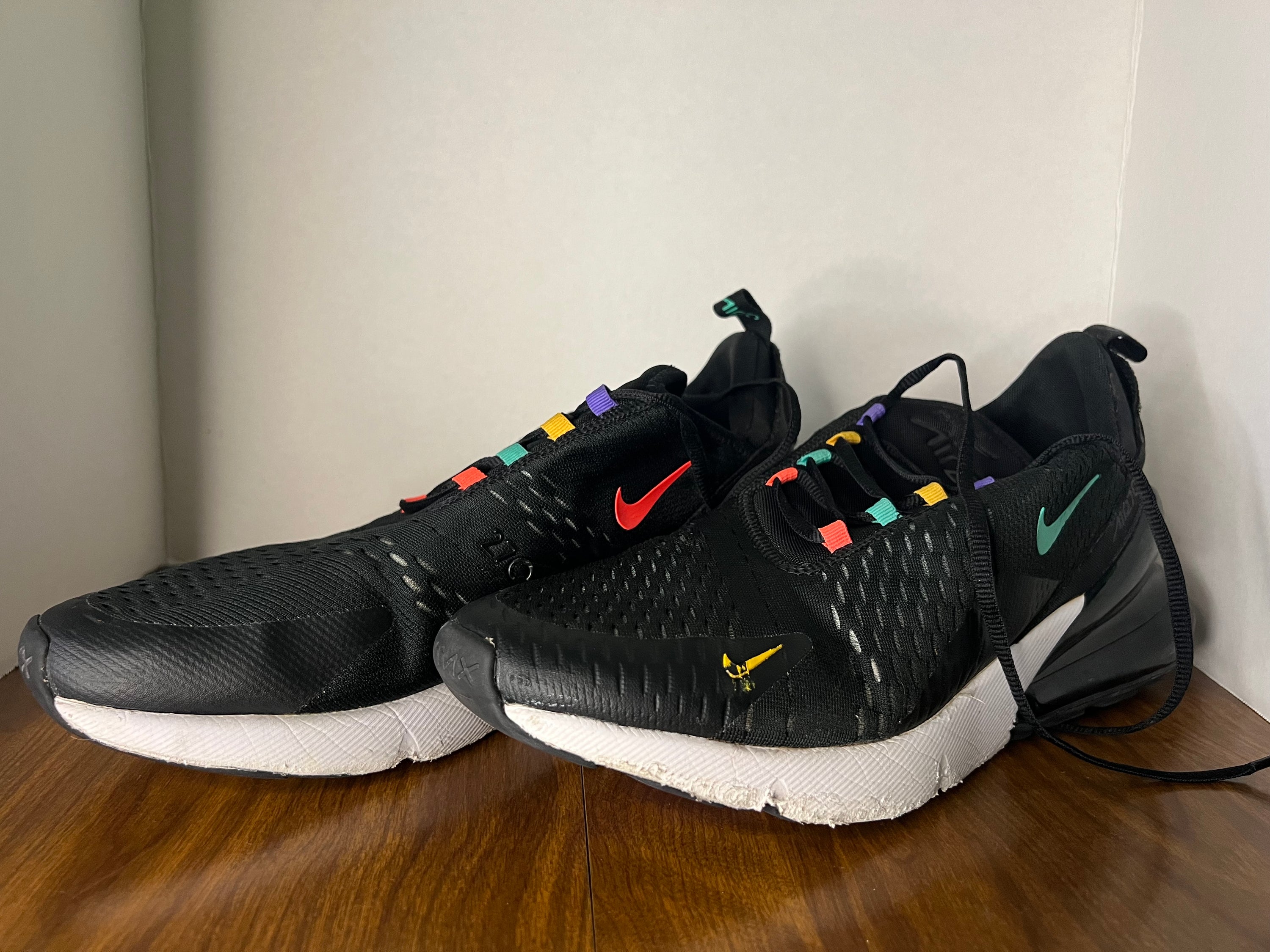 Nike Air Max 270 sneakers in black and multicolor design, size 11.5 for men, showcasing stylish and comfortable athletic footwear.