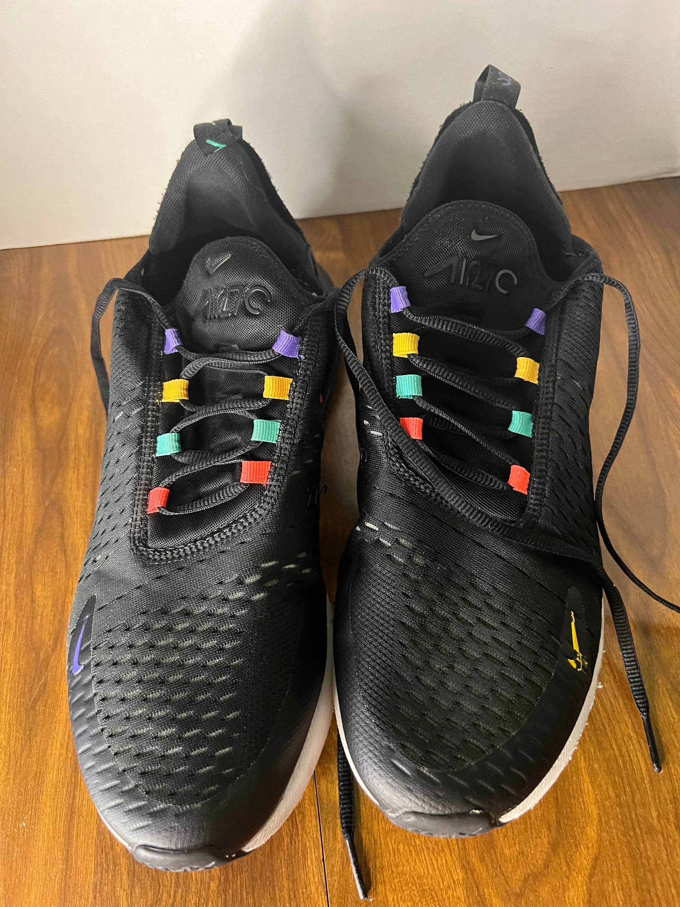 Nike Air Max 270 sneakers in black and multicolor design, size 11.5 for men, showcasing stylish and comfortable athletic footwear.