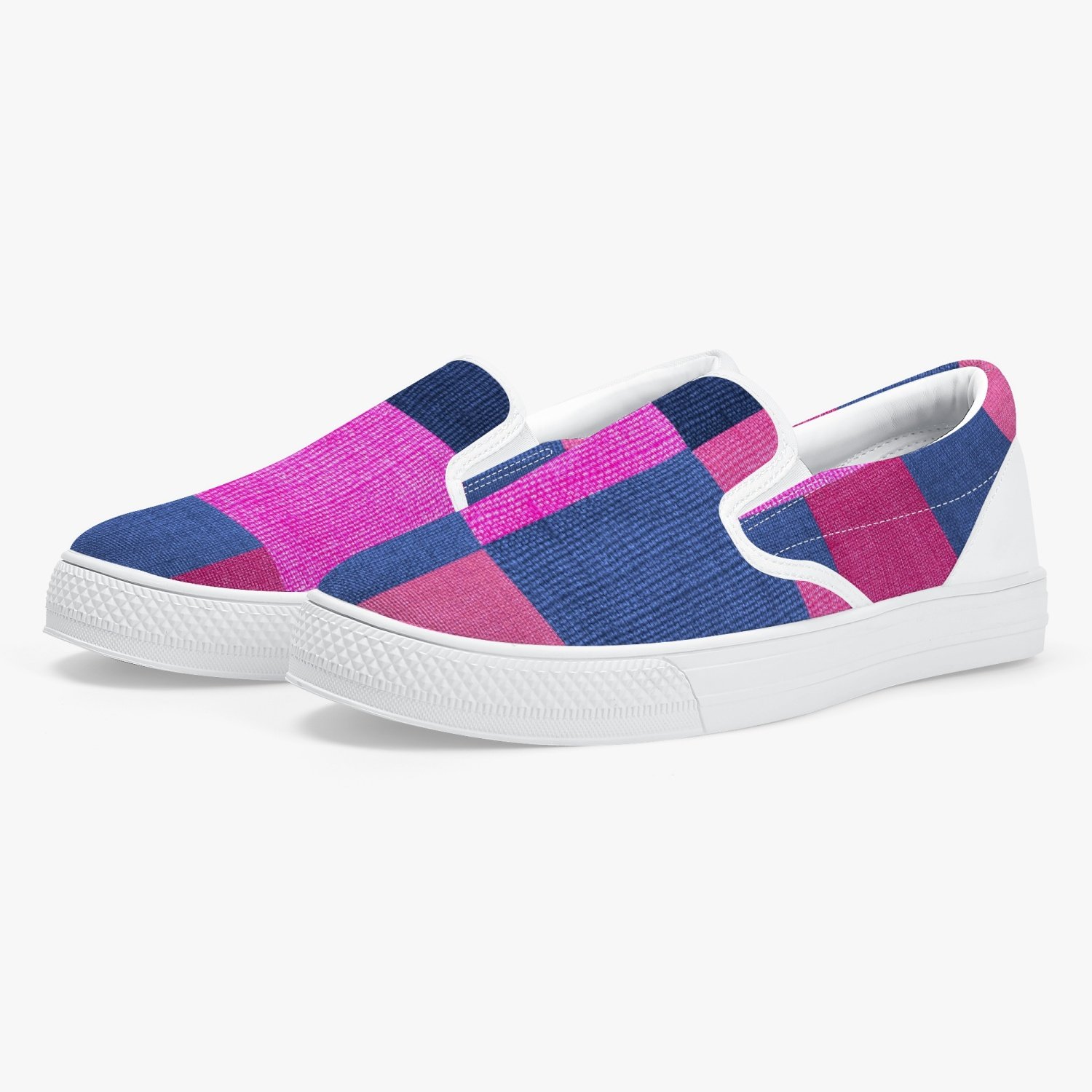 A pair of stylish white low-top slip-on canvas sports shoes designed for women, showcasing a sleek and modern athletic look.