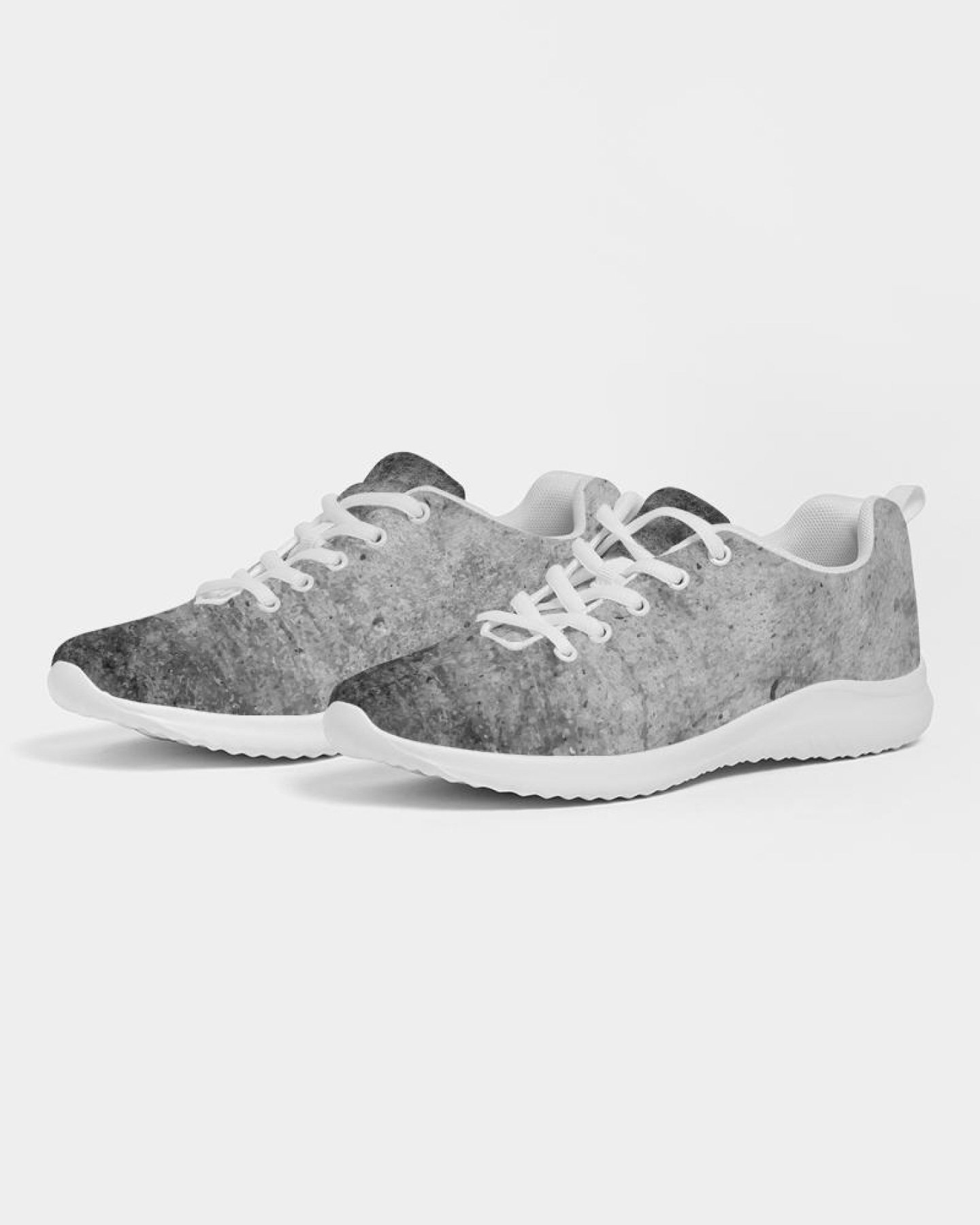 A pair of women's grey tie-dye style canvas sports shoes, featuring a lace-up front, padded collar, and soft insole, ideal for running and casual wear.