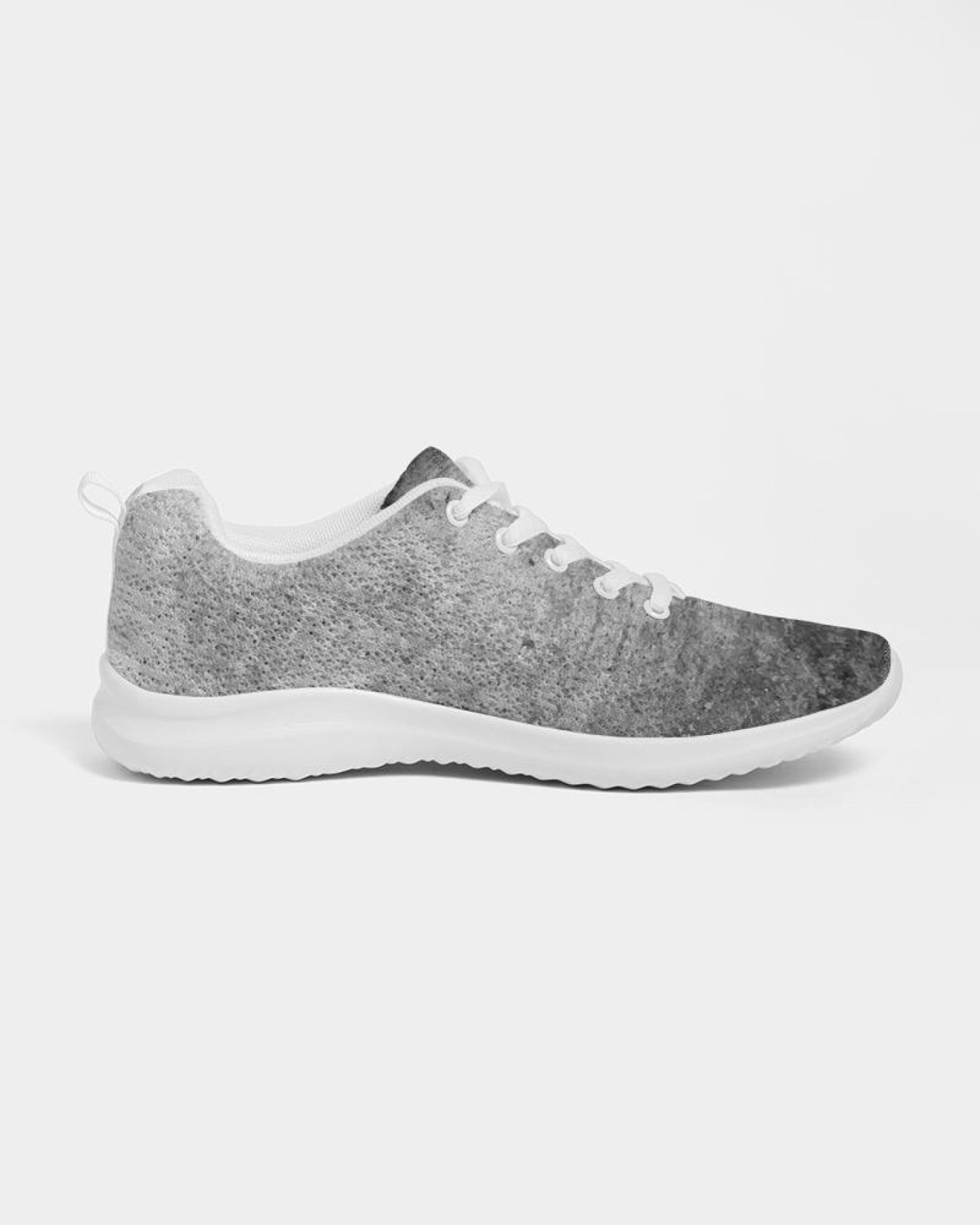 A pair of women's grey tie-dye style canvas sports shoes, featuring a lace-up front, padded collar, and soft insole, ideal for running and casual wear.