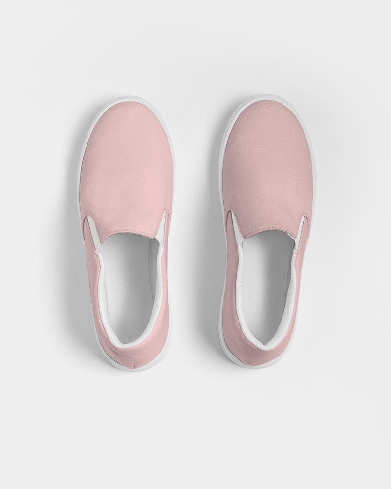 A pair of stylish women's slip-on canvas sports shoes in rose pink, featuring elastic side accents and a padded collar for comfort.