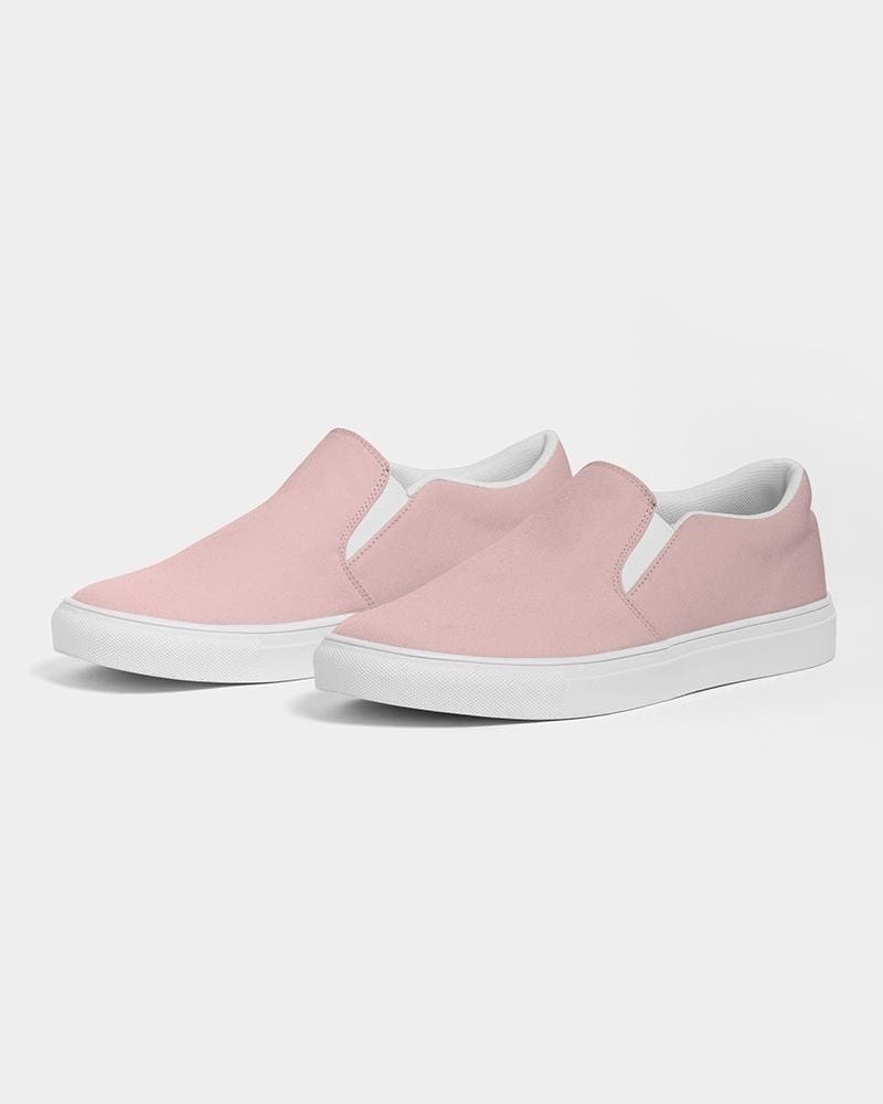 A pair of stylish women's slip-on canvas sports shoes in rose pink, featuring elastic side accents and a padded collar for comfort.