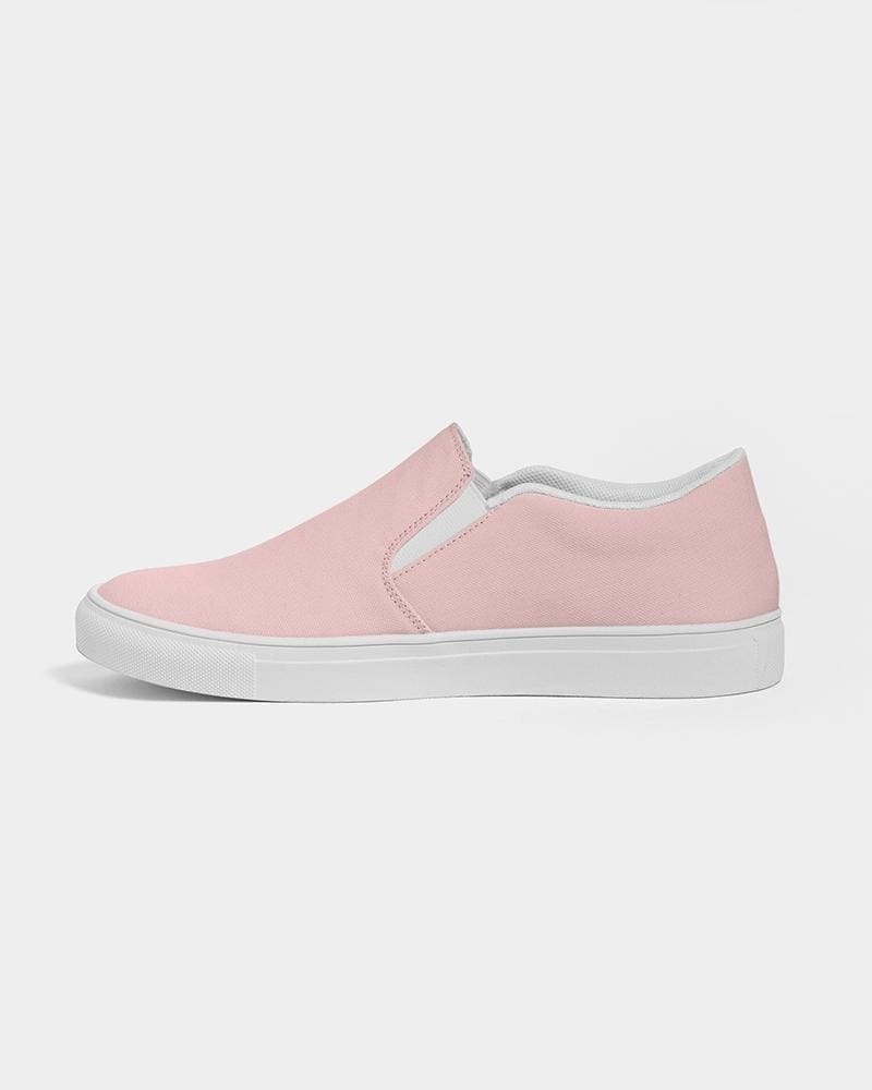 A pair of stylish women's slip-on canvas sports shoes in rose pink, featuring elastic side accents and a padded collar for comfort.