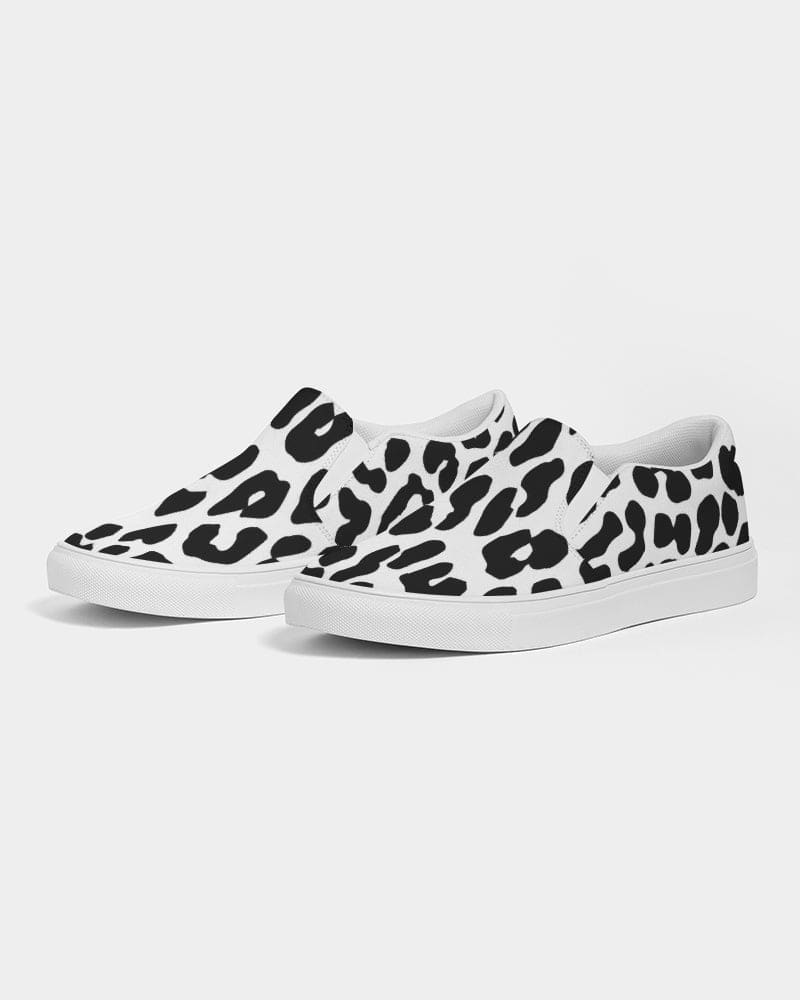 A pair of women's slip-on canvas sneakers featuring a stylish black and white leopard print design, perfect for casual wear.