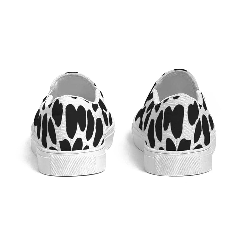 A pair of women's slip-on canvas sneakers featuring a stylish black and white leopard print design, perfect for casual wear.