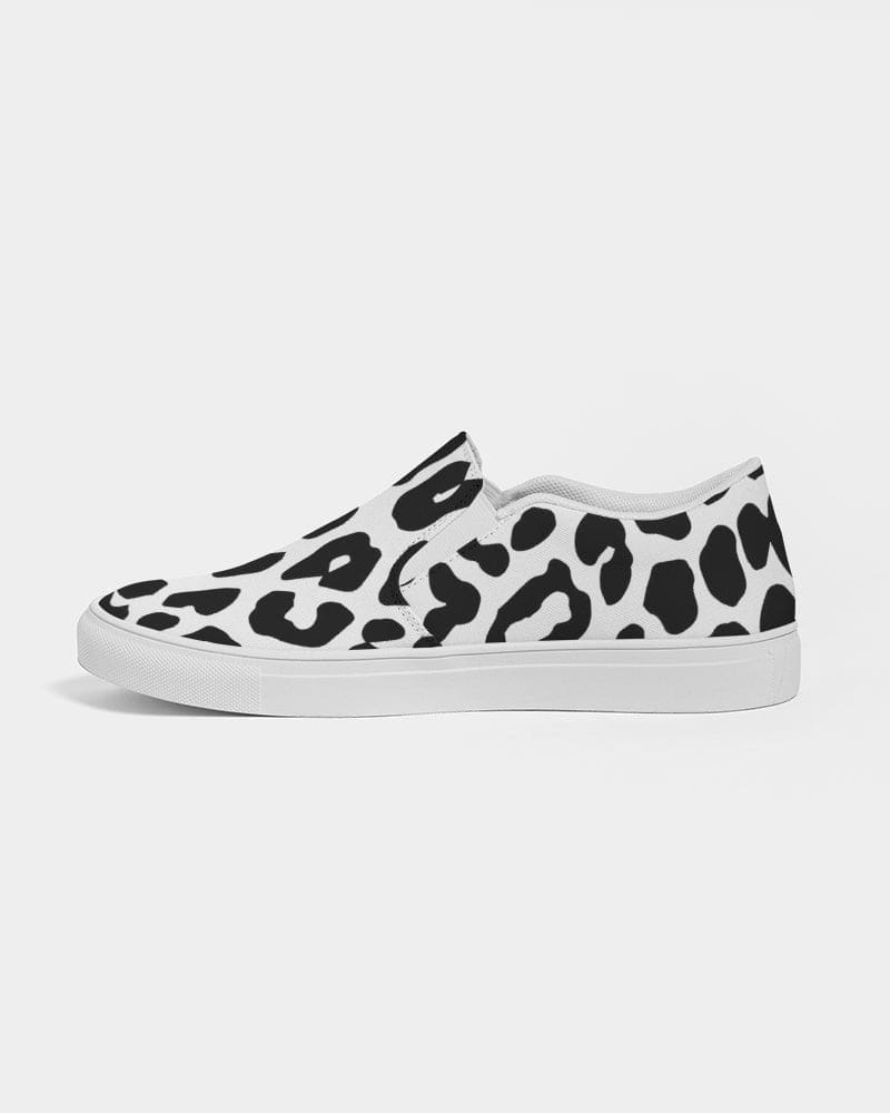 A pair of women's slip-on canvas sneakers featuring a stylish black and white leopard print design, perfect for casual wear.