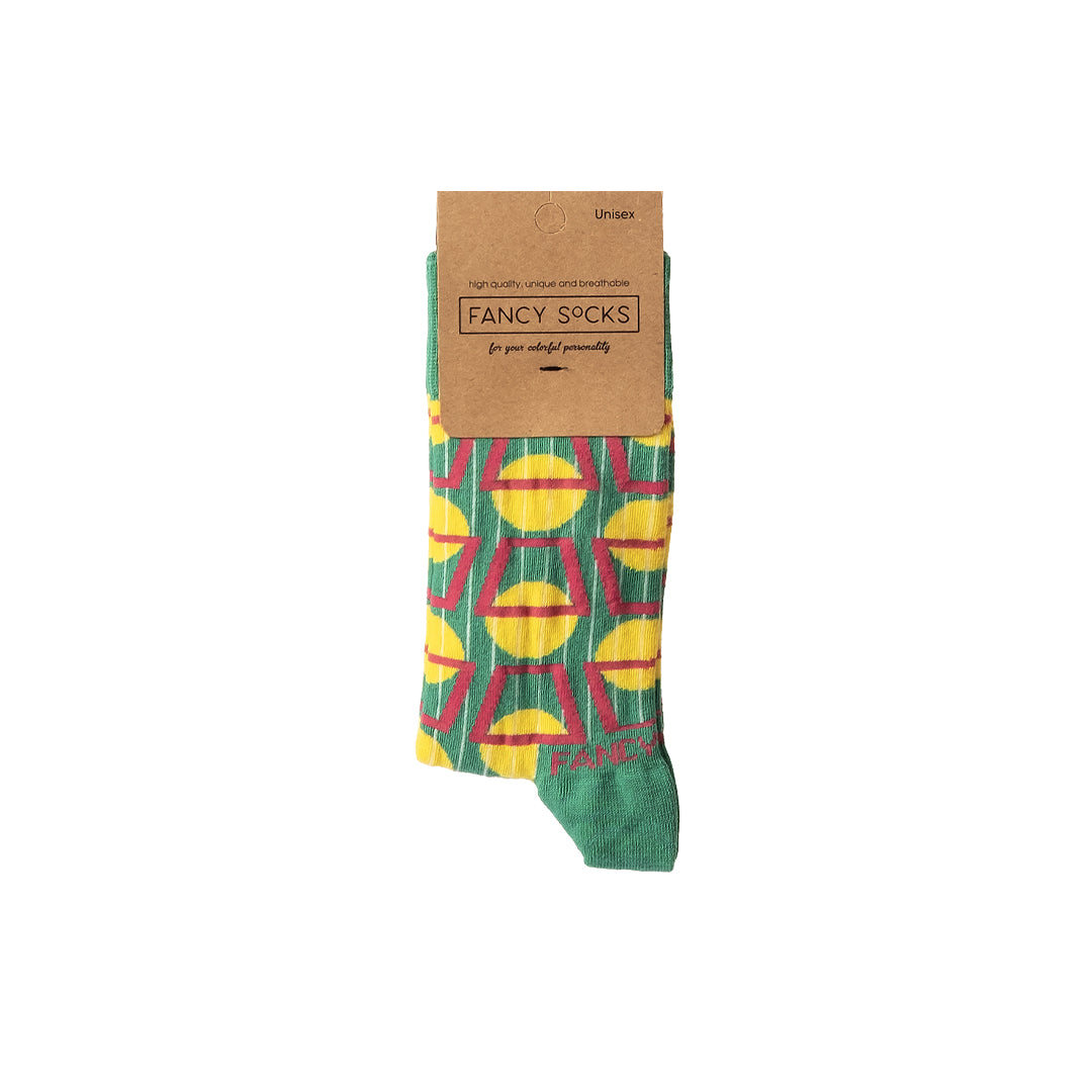 A pair of stylish black and green geometric socks displayed together, showcasing their unique design and vibrant colors.