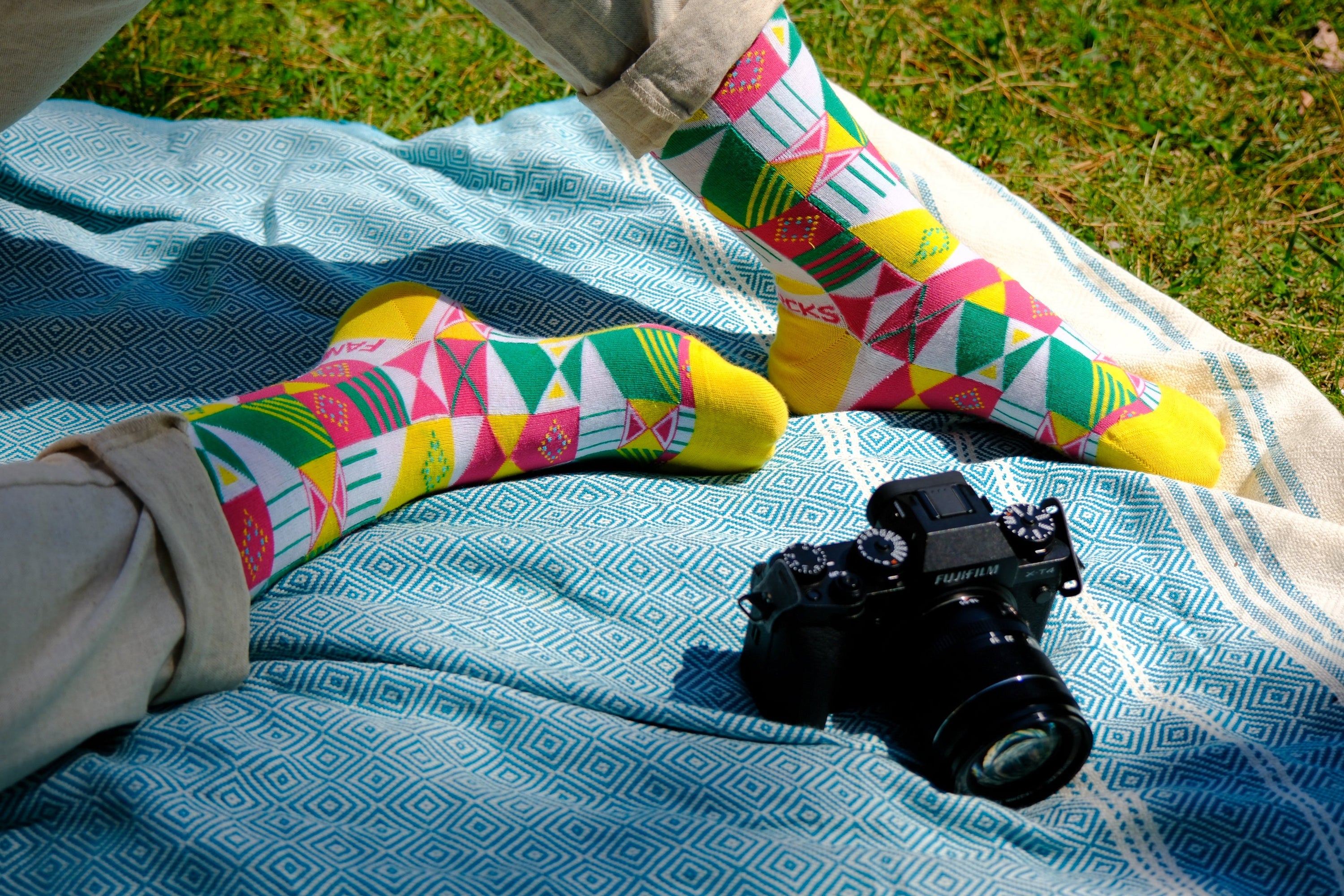 A pair of purple and white geometric socks displayed together, showcasing their stylish design and vibrant colors.