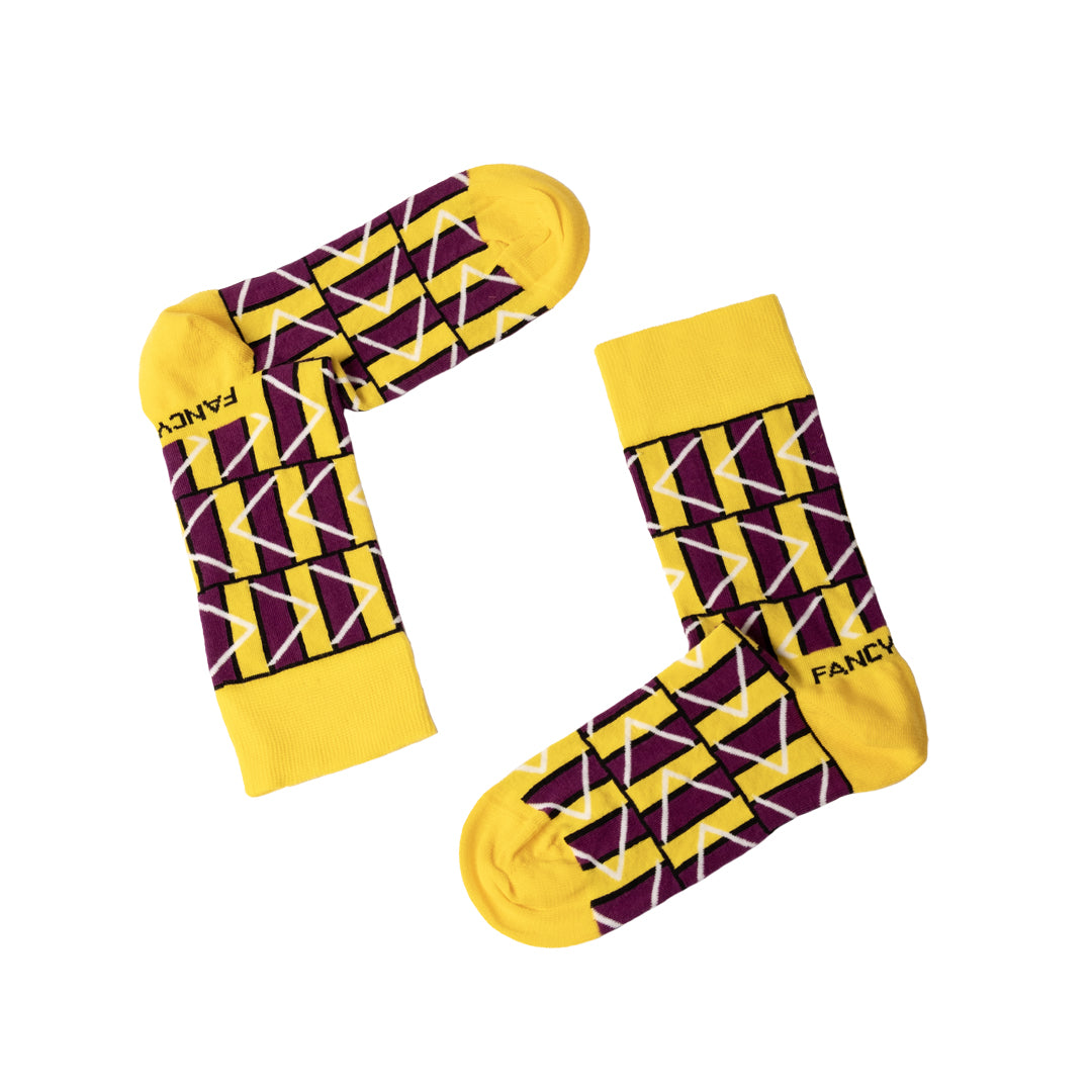 A pair of purple and white geometric socks displayed together, showcasing their stylish design and vibrant colors.