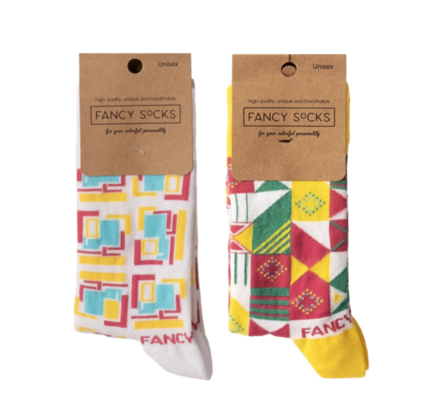 A pair of purple and white geometric socks displayed together, showcasing their stylish design and vibrant colors.