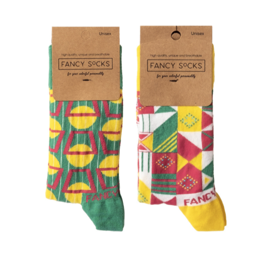 A pair of vibrant yellow and green geometric socks displayed together, showcasing their unique patterns and soft texture.