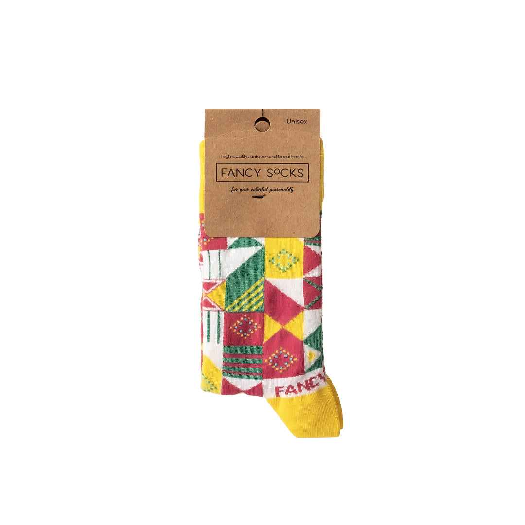 A pair of vibrant yellow and green geometric socks displayed together, showcasing their unique patterns and soft texture.