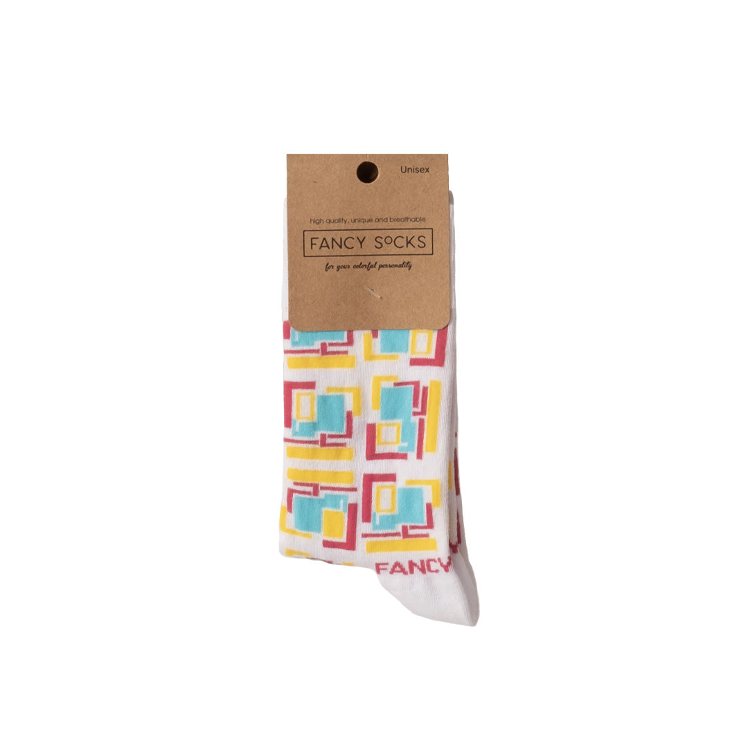 A pair of yellow and white geometric socks displayed together, showcasing their vibrant colors and stylish pattern.