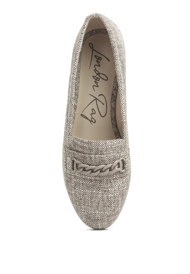 A pair of Abeera Chain Embellished Loafers showcasing a chic canvas design with chain detailing and a low heel.