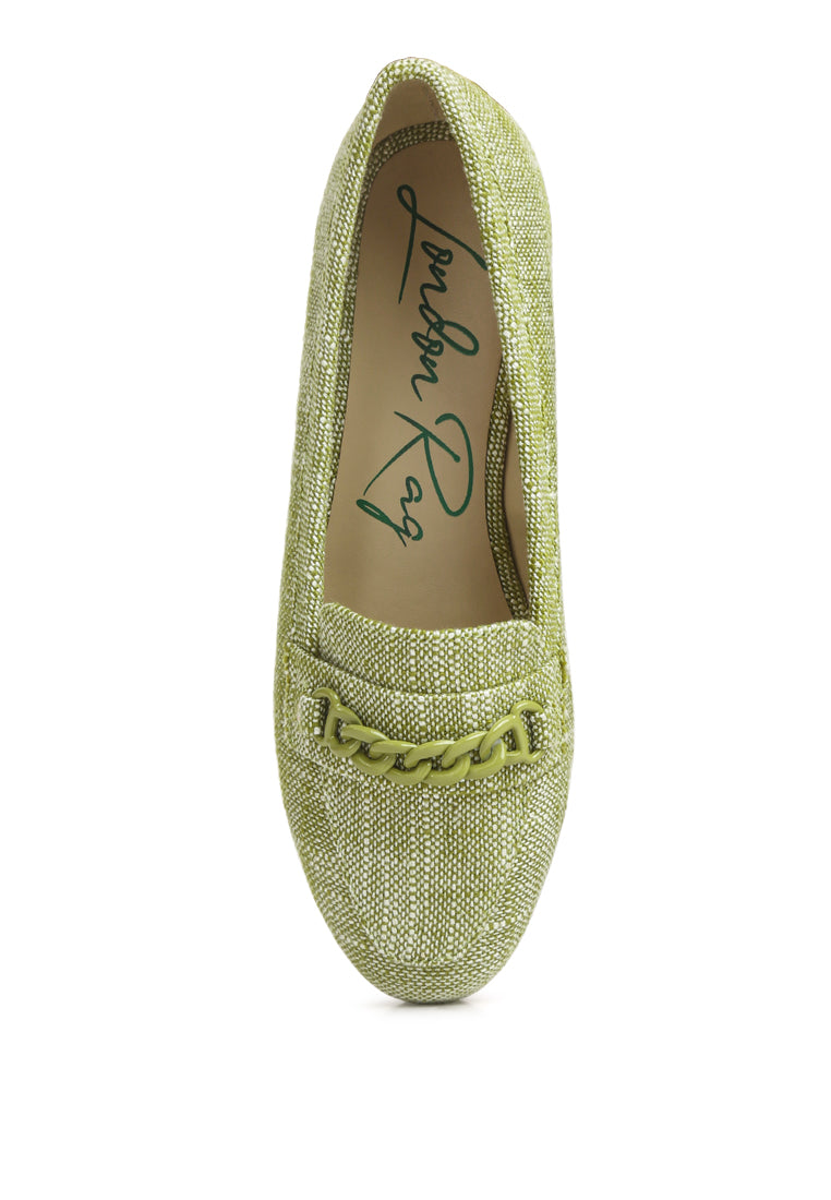 A pair of Abeera Chain Embellished Loafers showcasing a chic canvas design with chain detailing and a low heel.