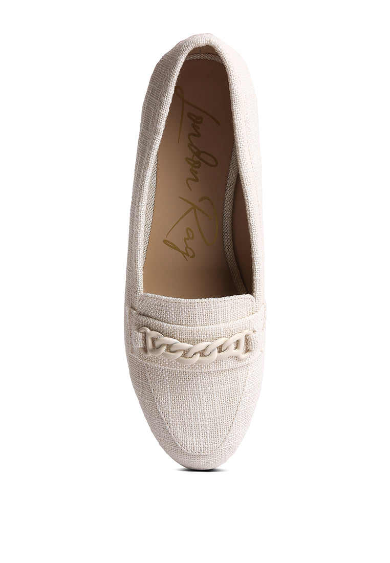 A pair of Abeera Chain Embellished Loafers showcasing a chic canvas design with chain detailing and a low heel.