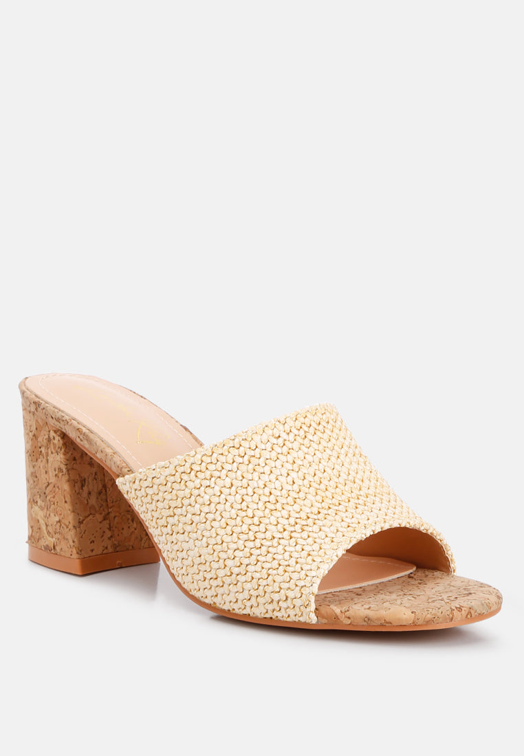 Addie Raffia Slip On Sandals featuring a stylish raffia upper, comfortable block heel, and cork texture detail, perfect for summer wear.