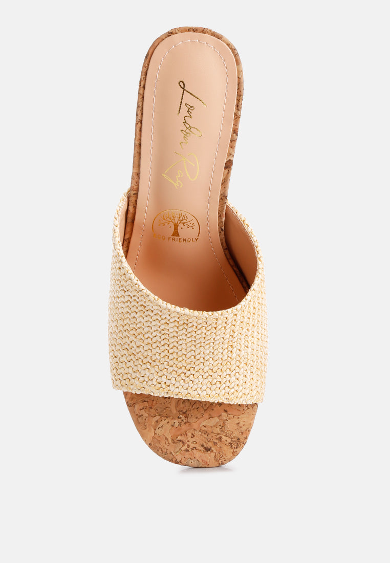 Addie Raffia Slip On Sandals featuring a stylish raffia upper, comfortable block heel, and cork texture detail, perfect for summer wear.