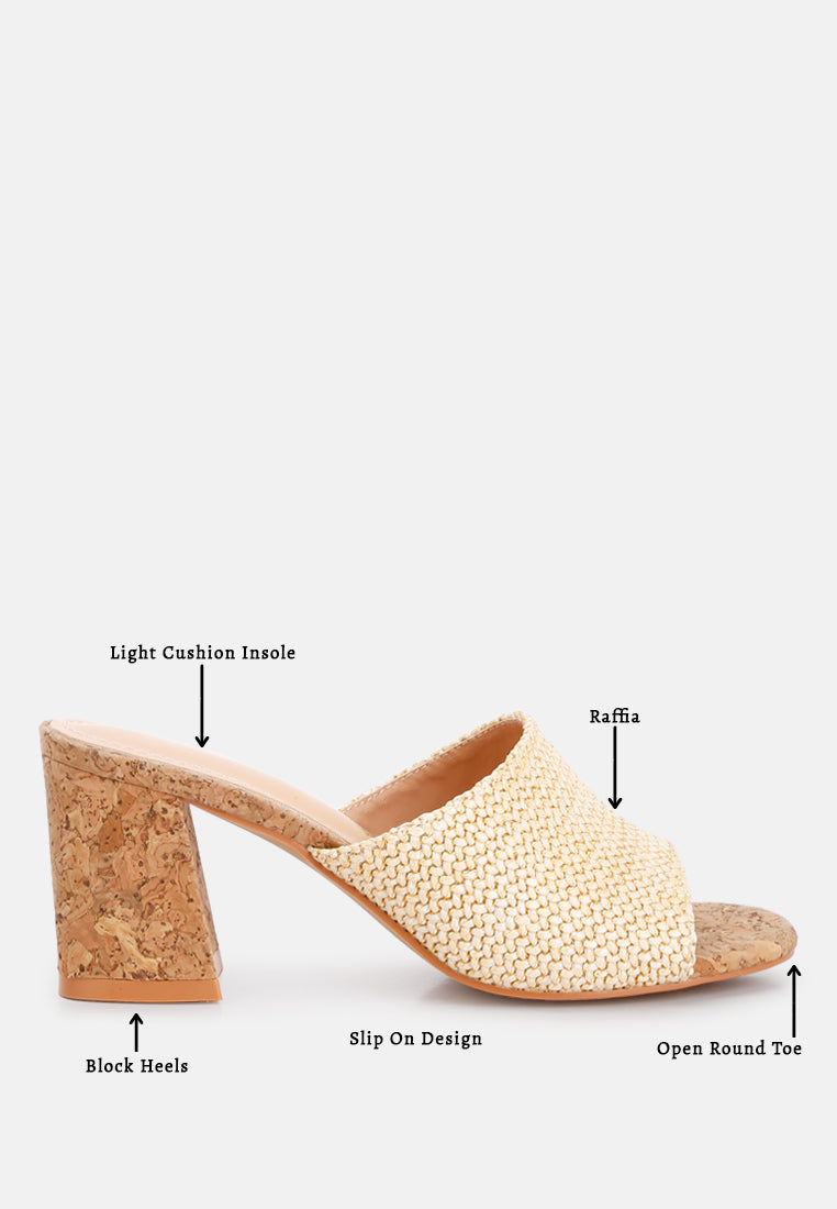 Addie Raffia Slip On Sandals featuring a stylish raffia upper, comfortable block heel, and cork texture detail, perfect for summer wear.