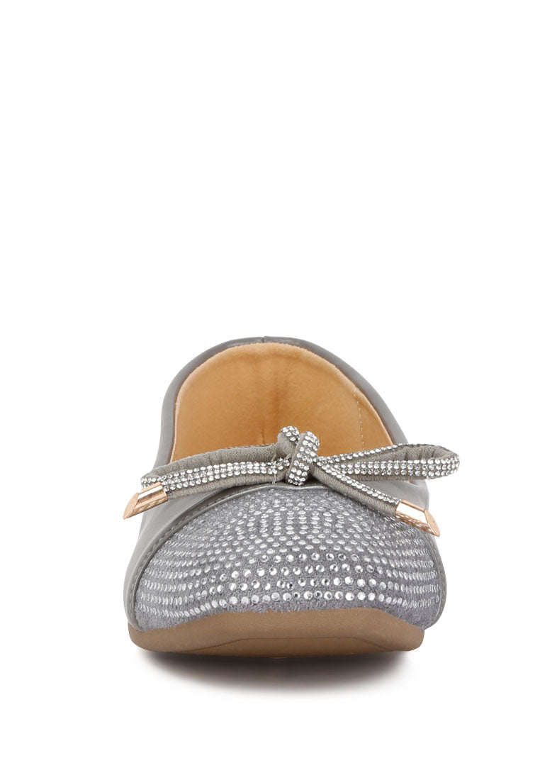 Aine Rhinestones Embellished Toe Cap Ballerinas featuring a faux leather upper, rhinestone toe cap, and elegant bow detail.