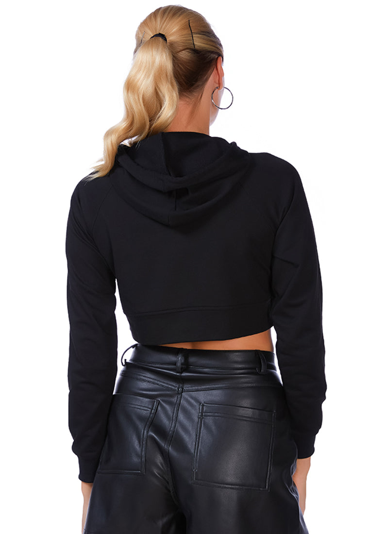 A stylish cropped hoodie with a front slit, made of 100% cotton, featuring full sleeves and a drawstring hood.