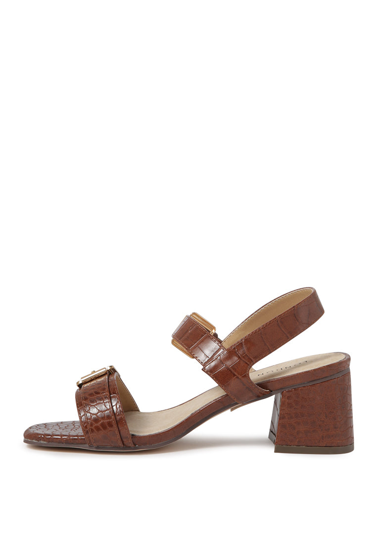 Amara Croc Textured Slingback Sandals featuring a block heel and adjustable buckle in stylish croc print faux leather.