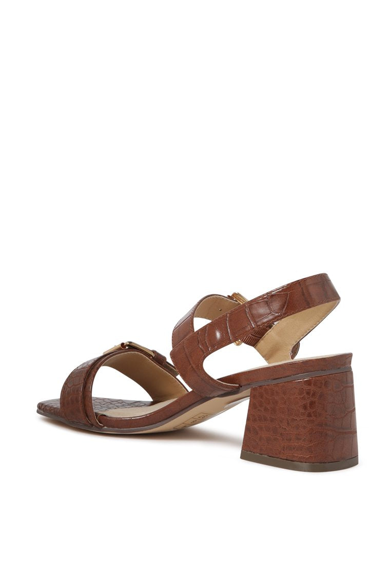 Amara Croc Textured Slingback Sandals featuring a block heel and adjustable buckle in stylish croc print faux leather.