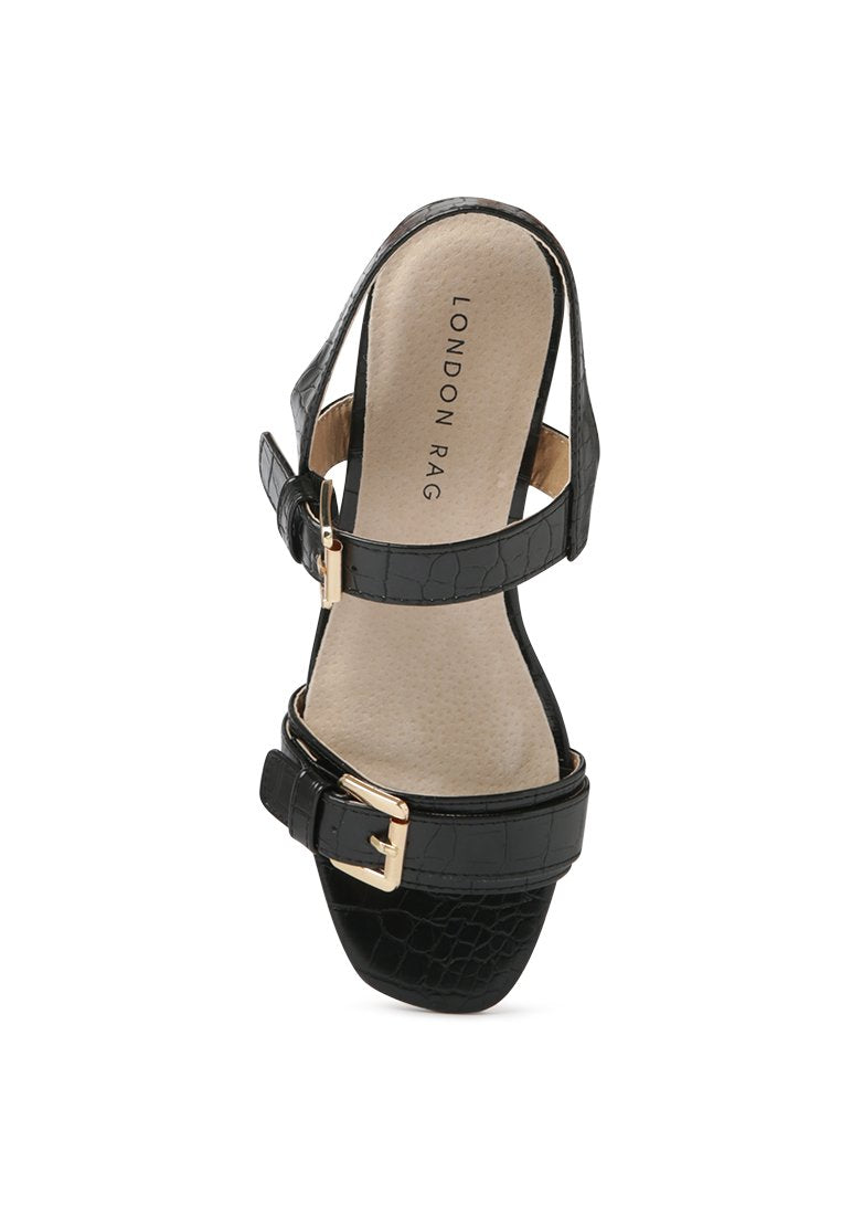 Amara Croc Textured Slingback Sandals featuring a block heel and adjustable buckle in stylish croc print faux leather.