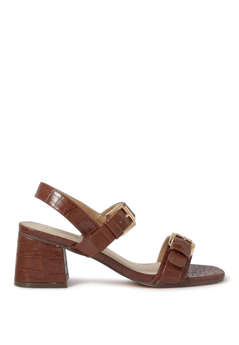 Amara Croc Textured Slingback Sandals featuring a block heel and adjustable buckle in stylish croc print faux leather.