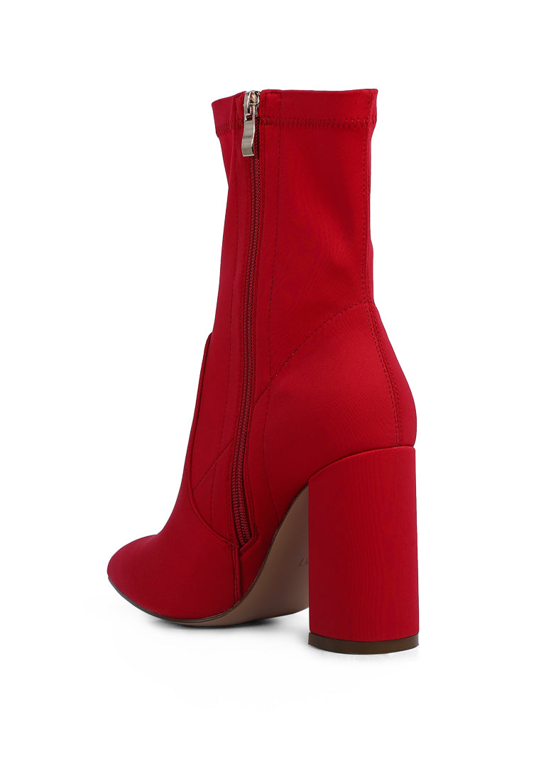 A pair of stylish ankle Lycra block heeled boots with a pointed toe and side zipper, perfect for women's fashion.